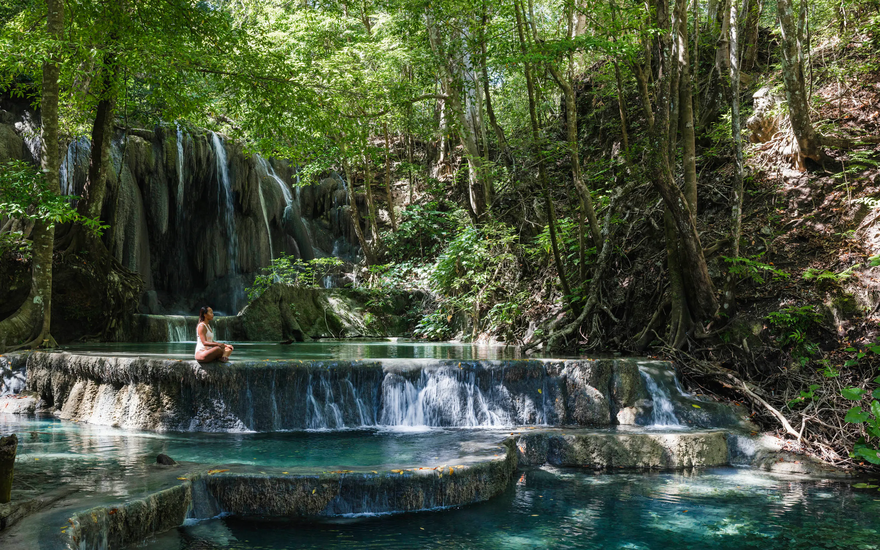 Woman sitting at the Mata Jitu waterfall