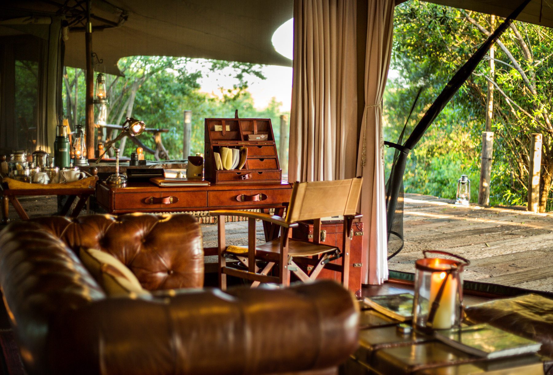A safari suite deck with open canvas and wooden flooring at Mara Plains Camp, set in Kenya's Maasai Mara.