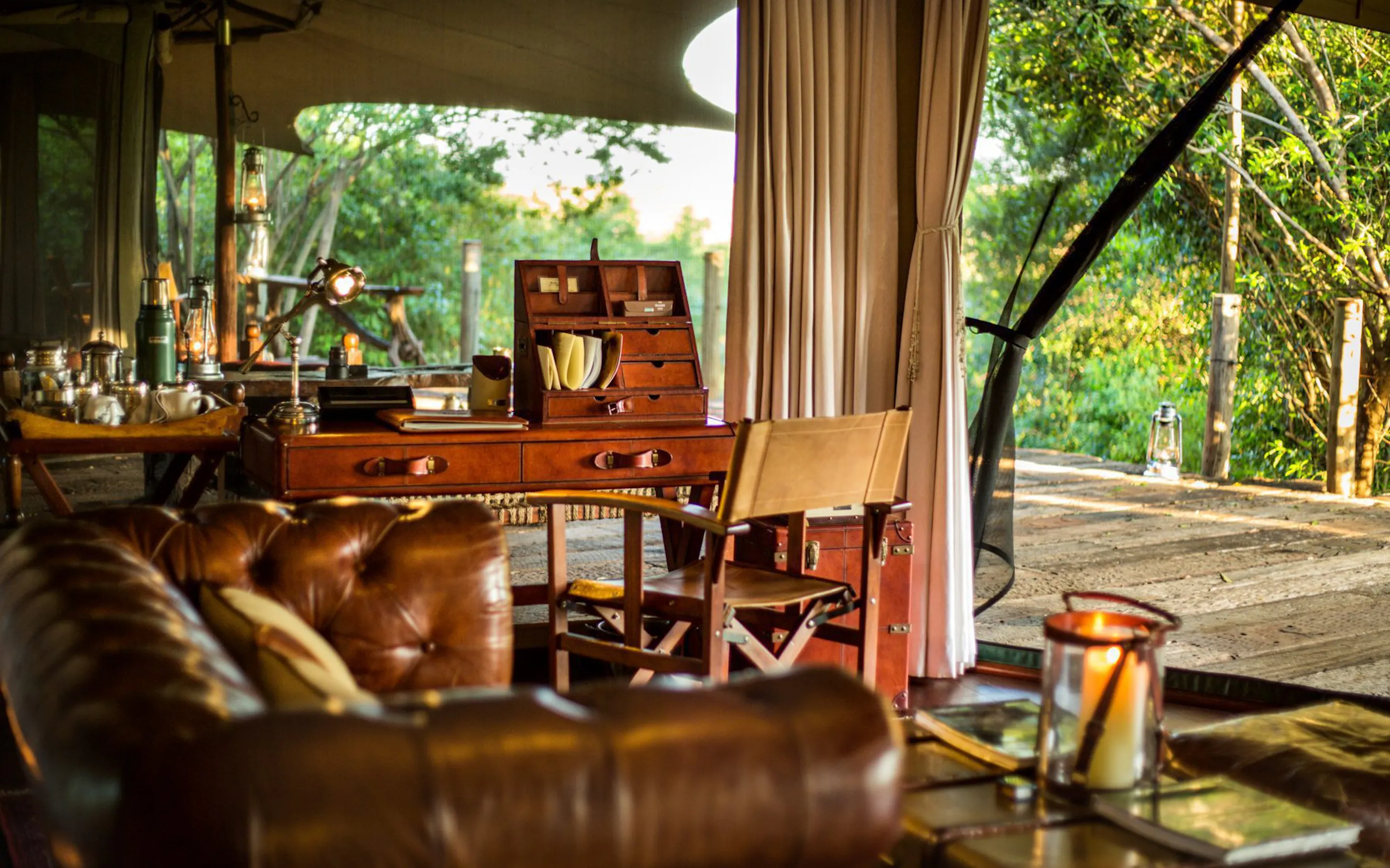 A safari suite deck with open canvas and wooden flooring at Mara Plains Camp, set in Kenya's Maasai Mara.