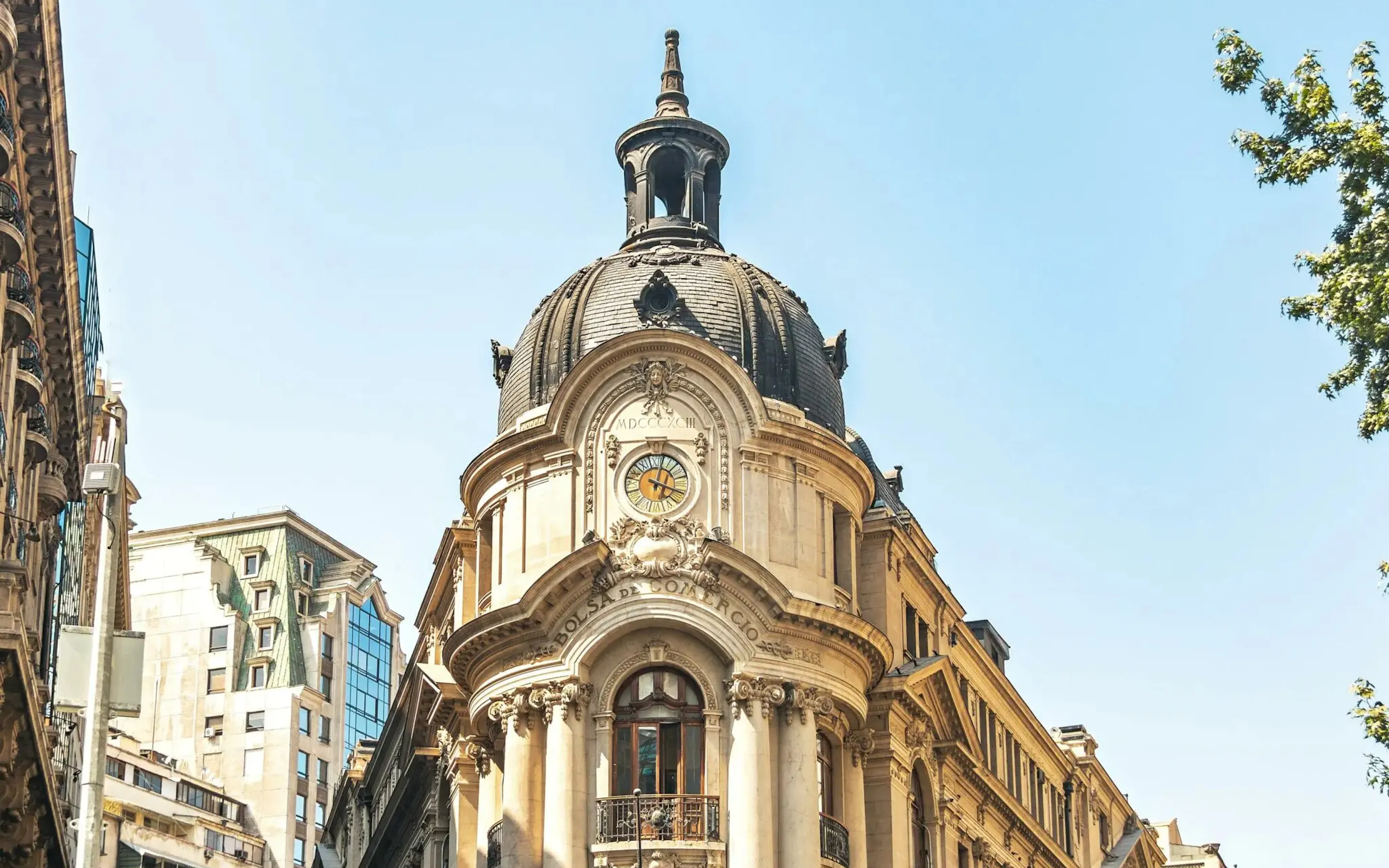 The ornate facade of Santiago's stock exchange rises above the street under a clear blue sky in central Chile.