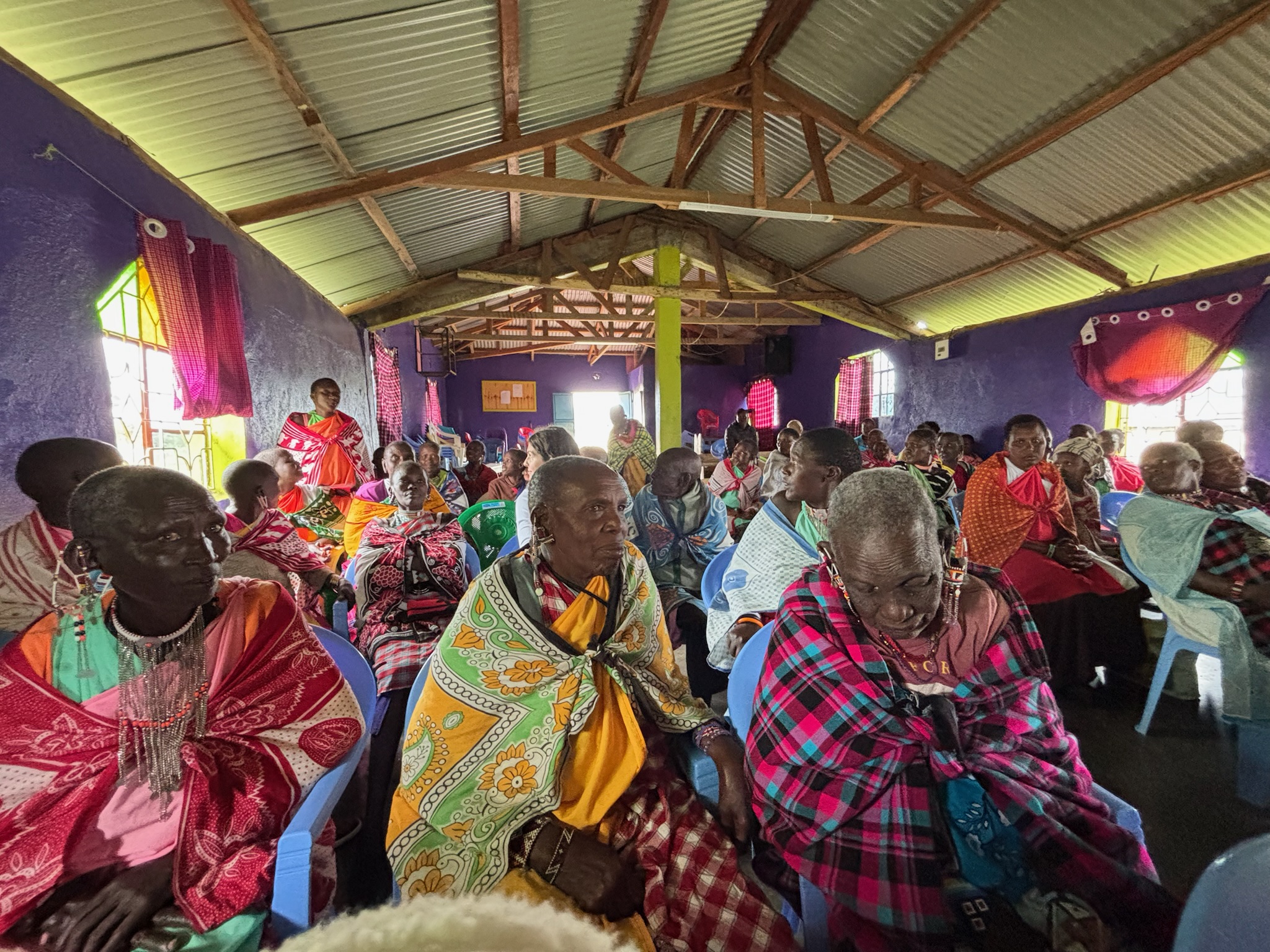 A group of Samburu women learning about menstrual cups from Great Being a Girl, Kenya