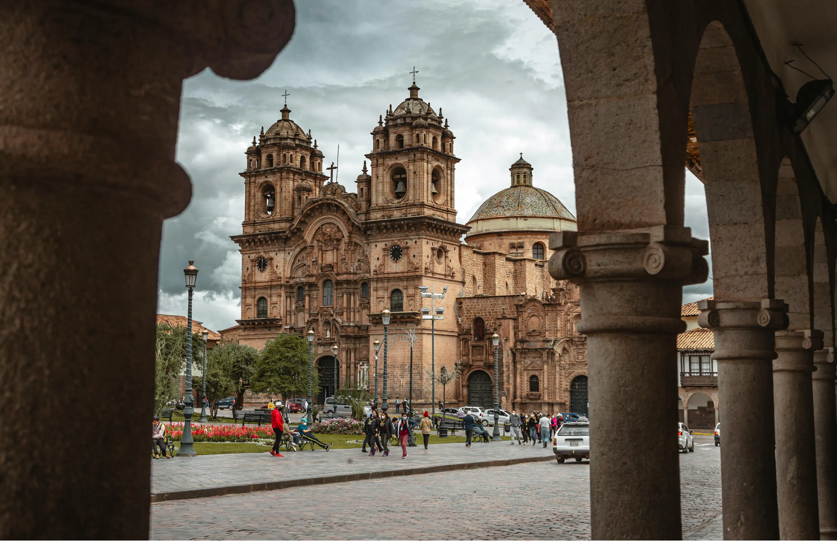 The ornate Baroque facade of Cusco Cathedral faces the wide cobblestone Plaza de Armas.