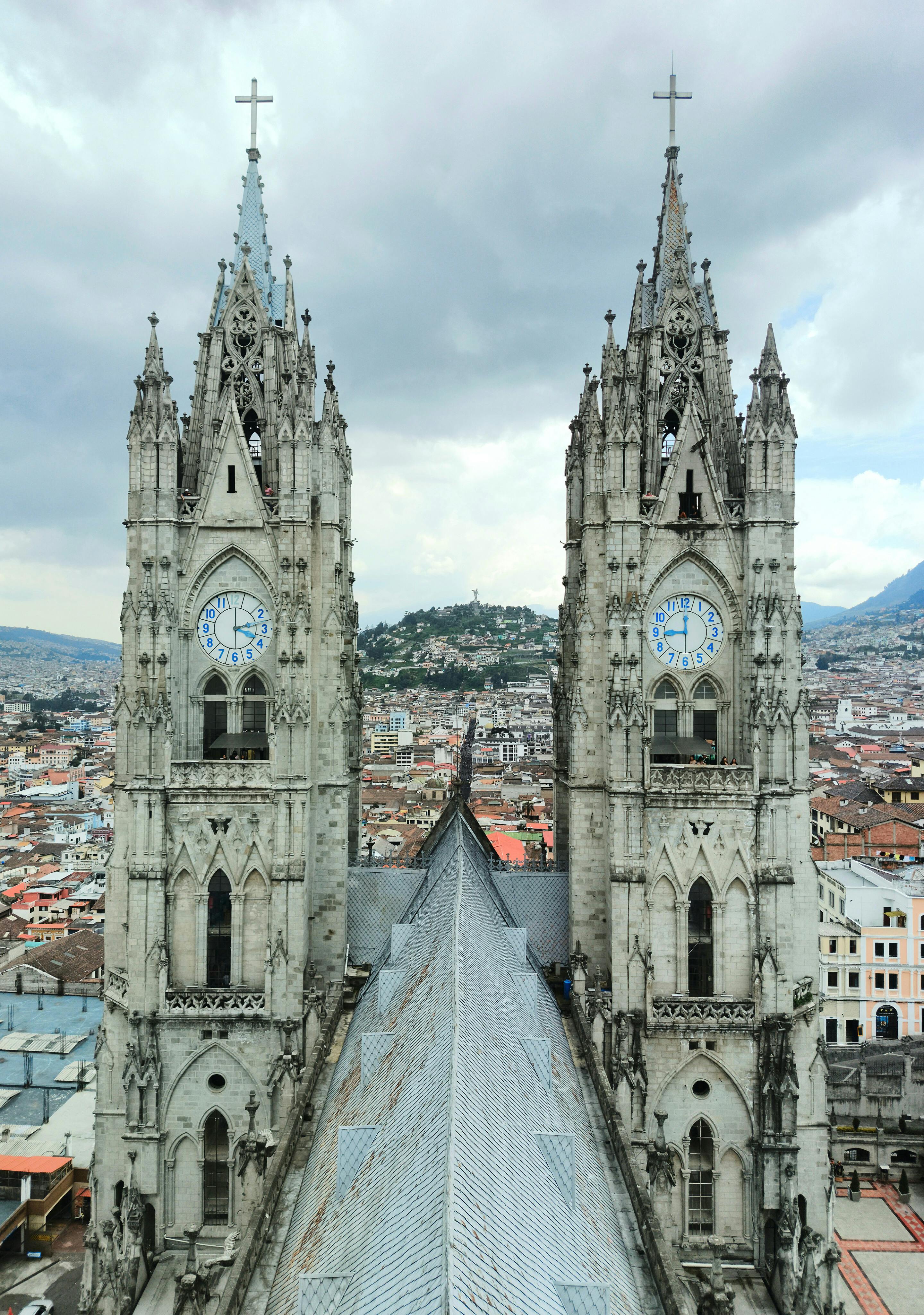 The towering neo-Gothic spires of the Basílica del Voto Nacional rise above Quito's historic center.