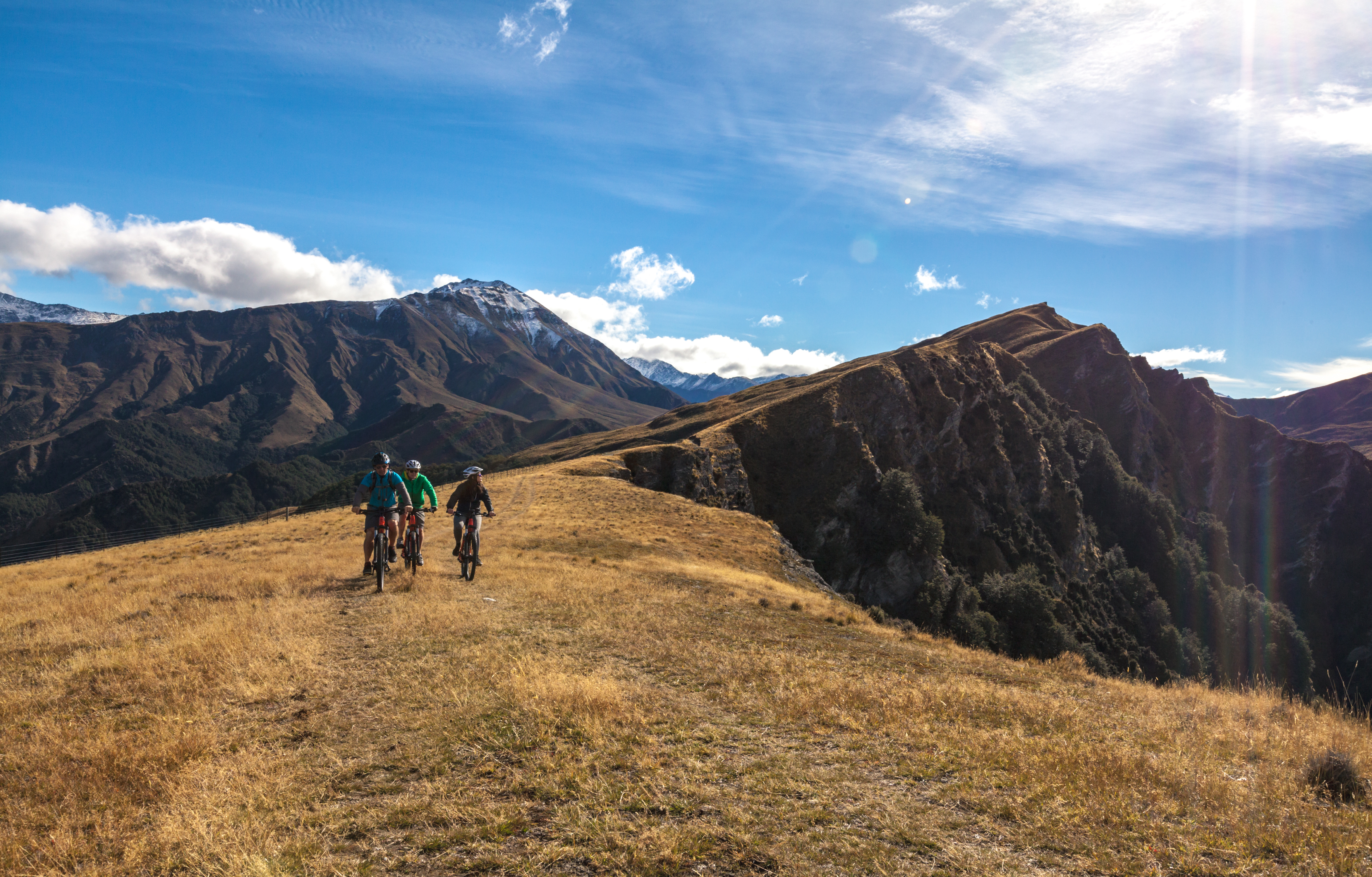 Queenstown sits on the shore of Lake Wakatipu with the Remarkables mountain range rising beyond.