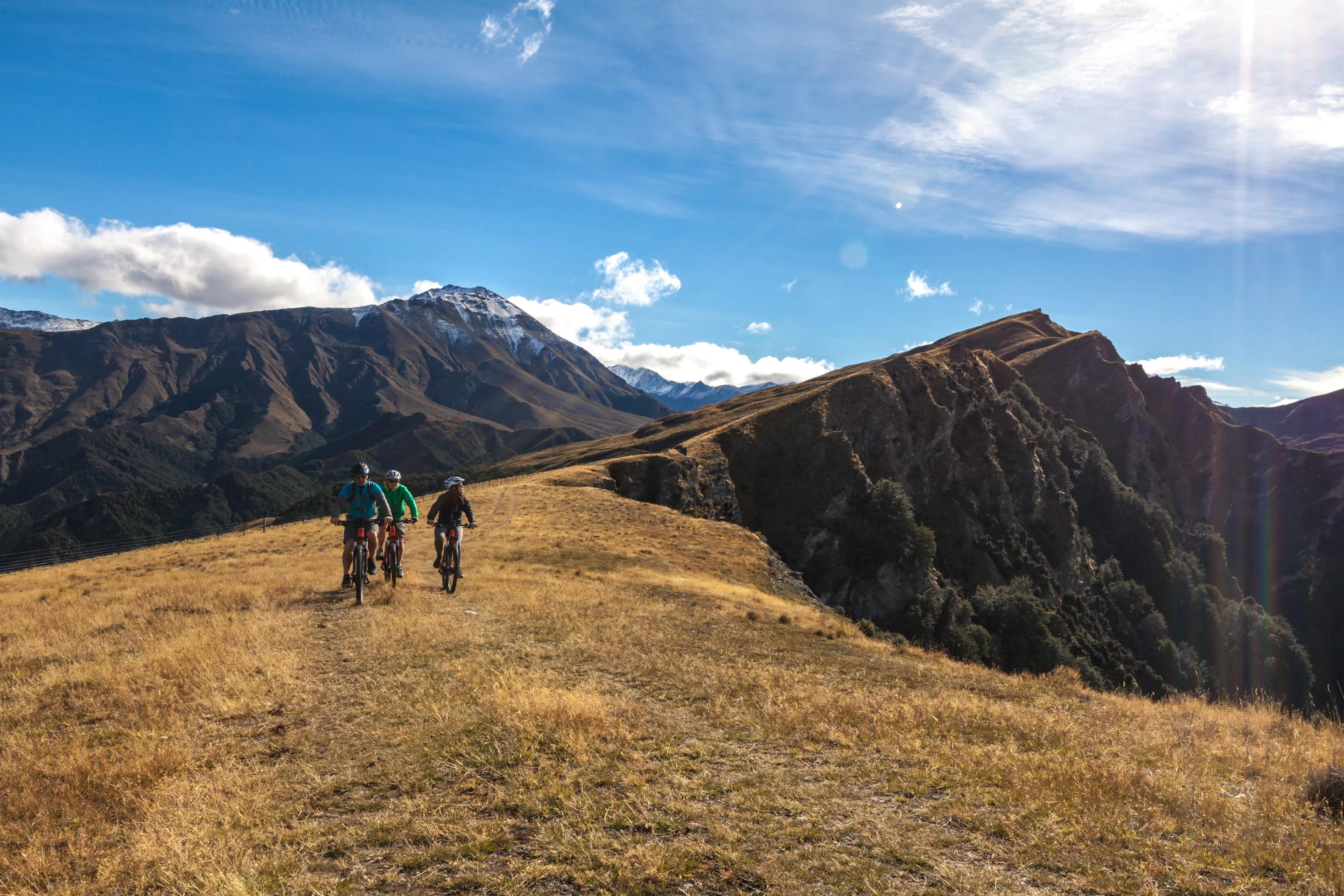 Queenstown sits on the shore of Lake Wakatipu with the Remarkables mountain range rising beyond.