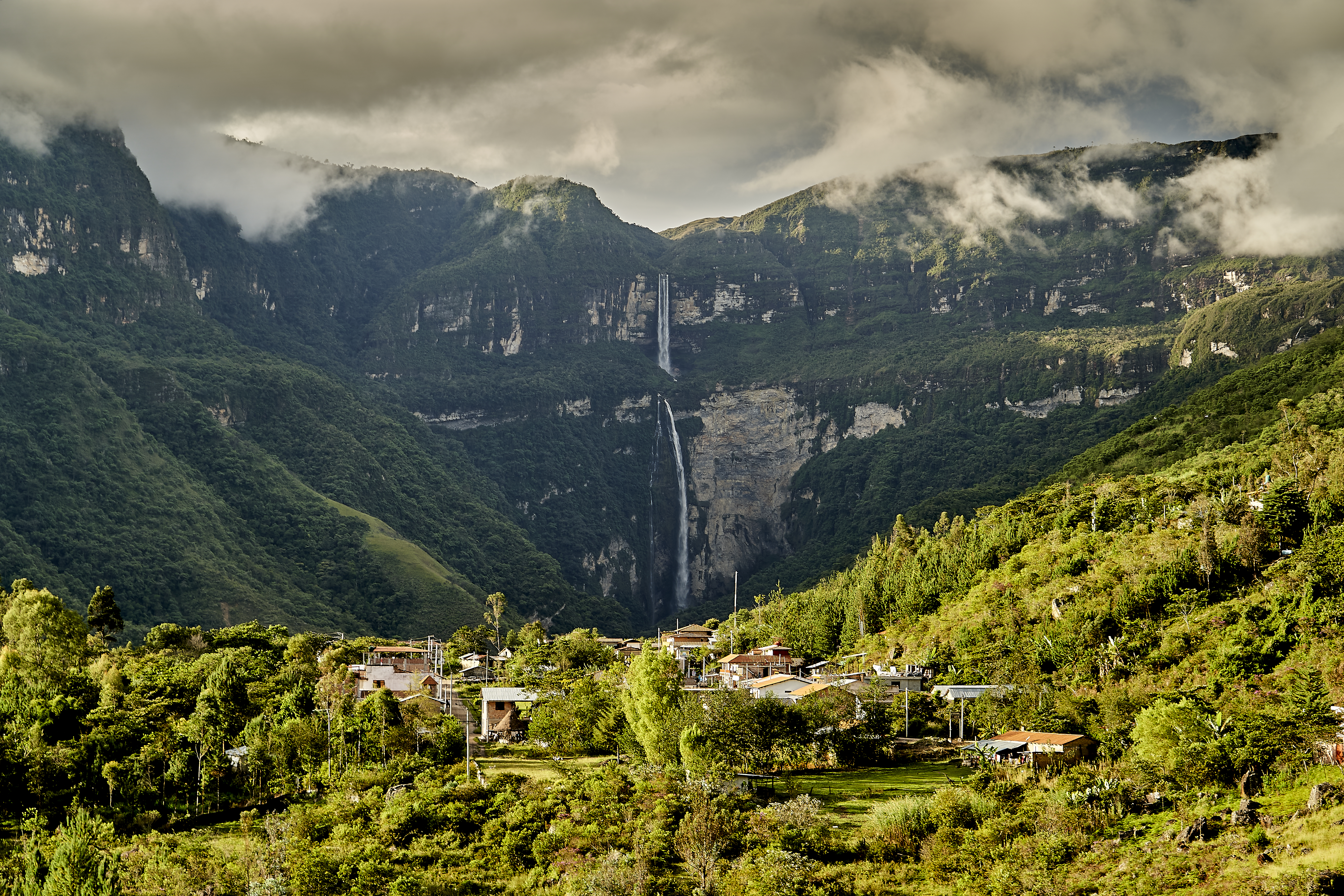 The Gocta waterfall plunges in two long cascades down a green cliff into the Amazon jungle.