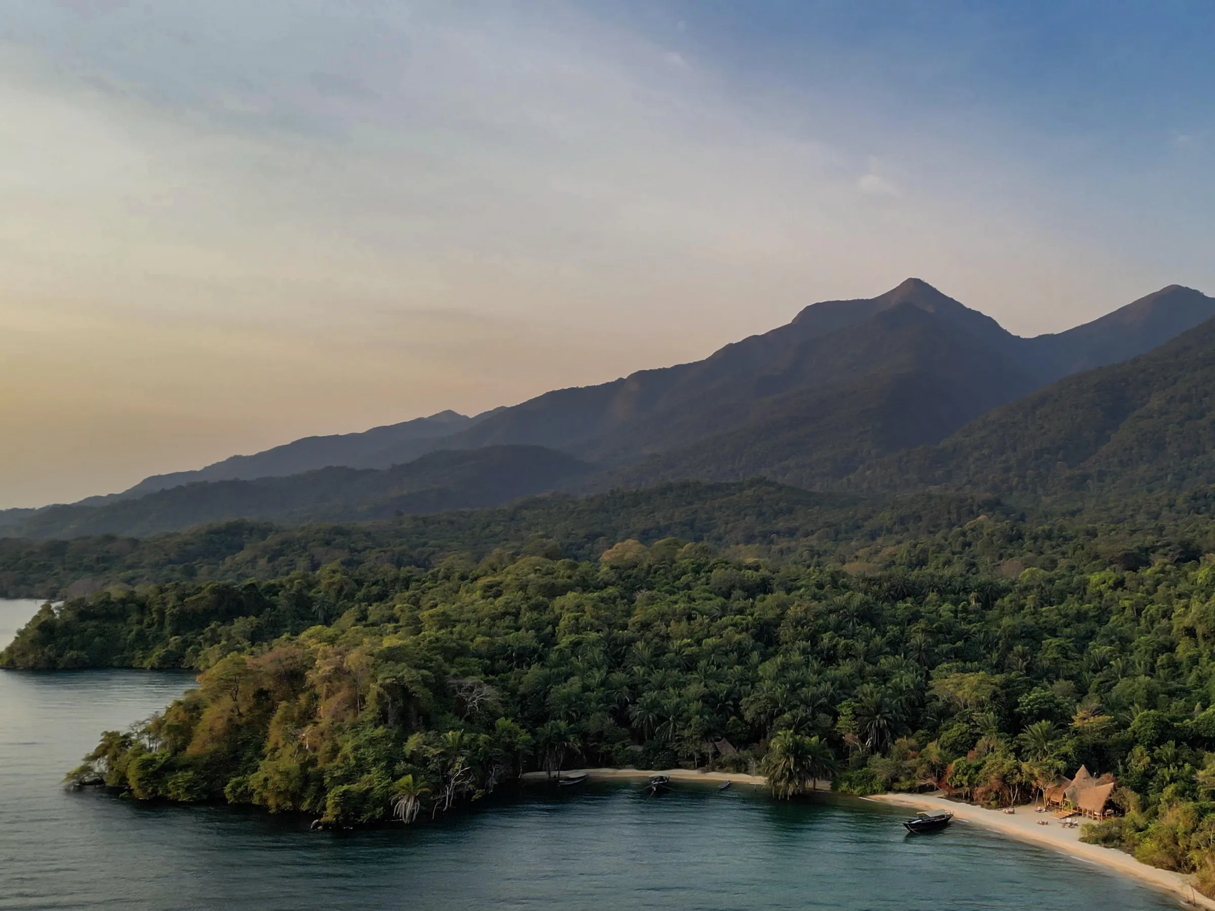 Aerial view of the Greystoke Mahale camp on a jungle promontory beside Lake Tanganyika.