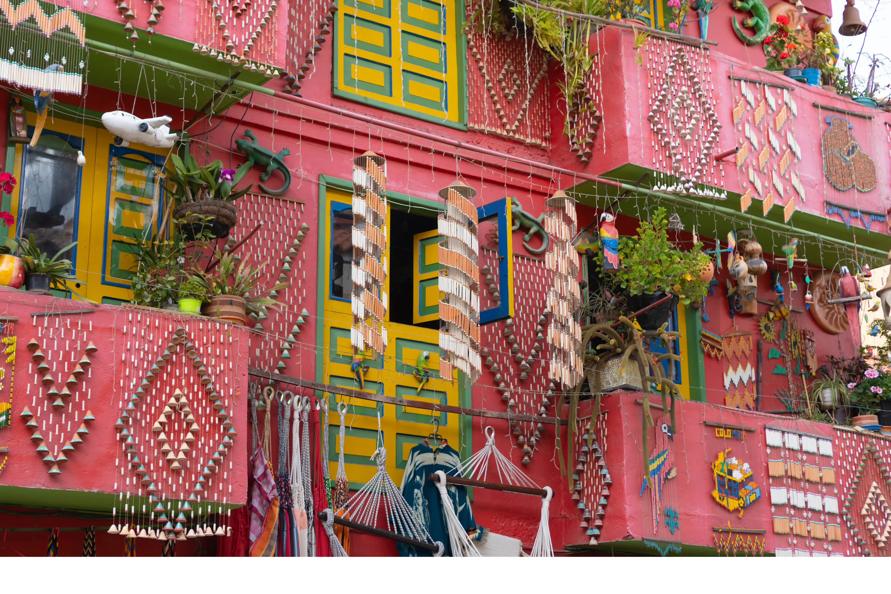 Brightly painted balconies draped in textiles and rugs line a vibrant street in Villa de Leyva.