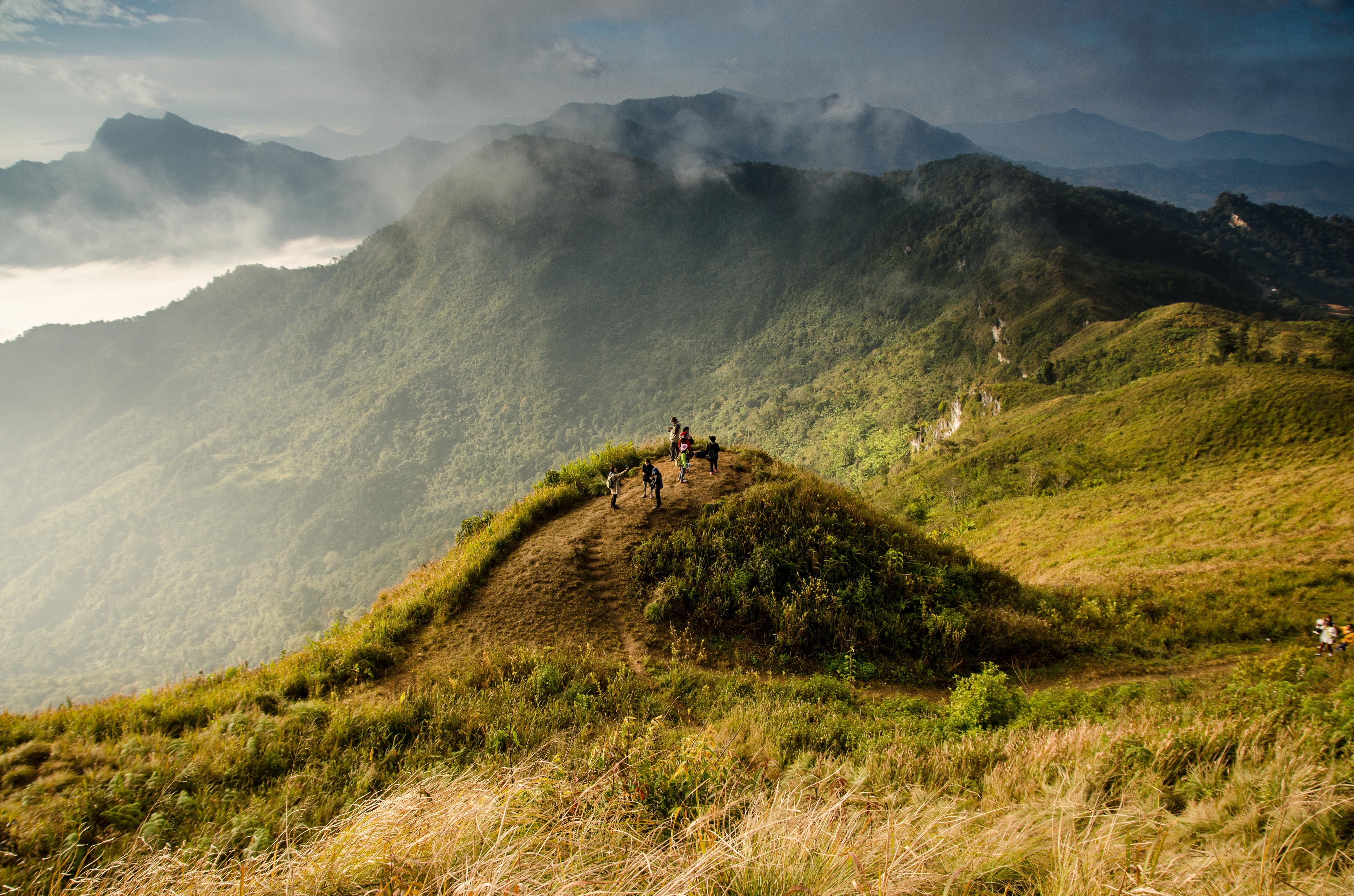 Hikers on a misty mountain ridge overlooking Valle de Antón, Panama