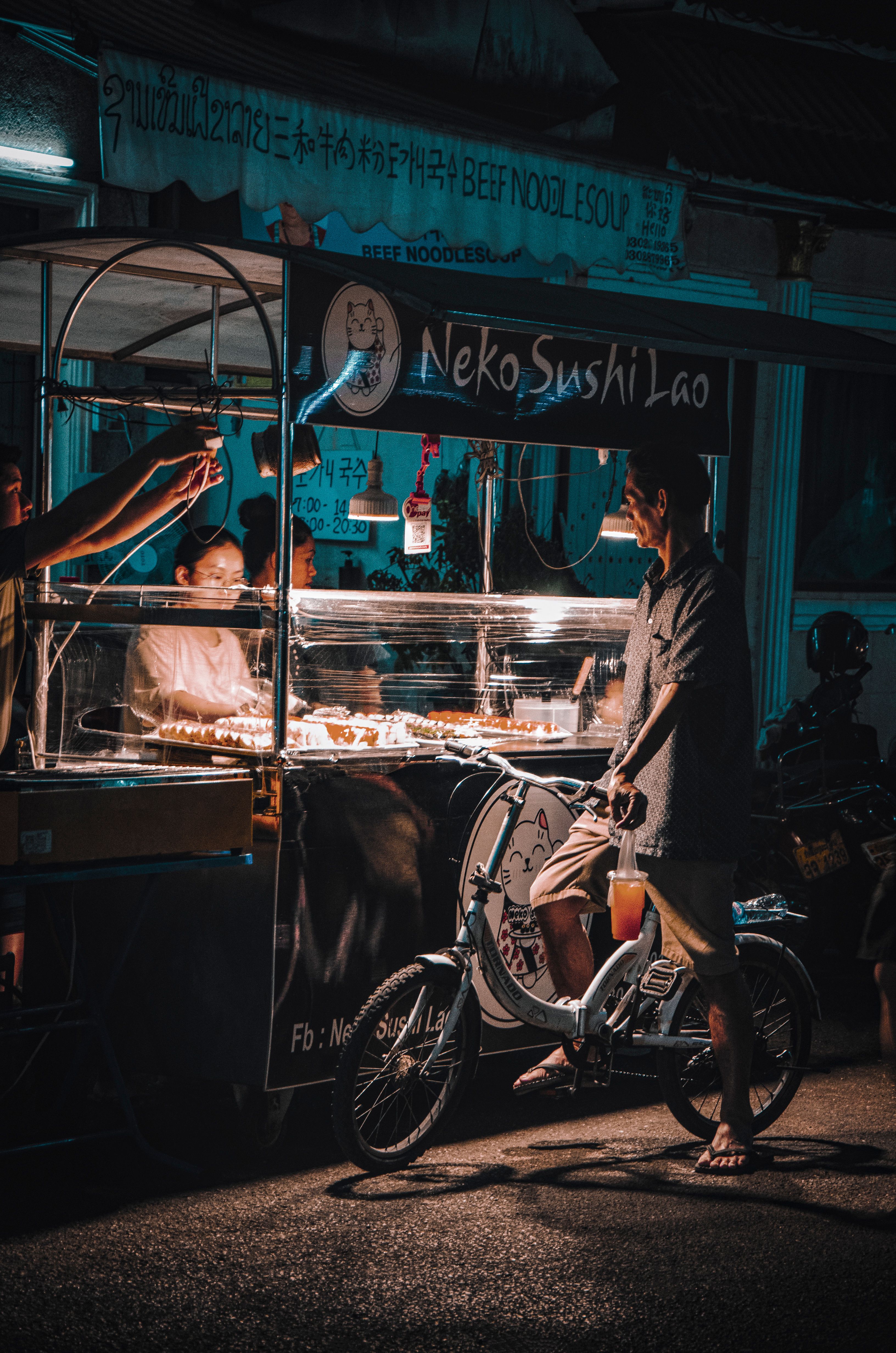 Night street food cart selling sushi in Vientiane, Laos
