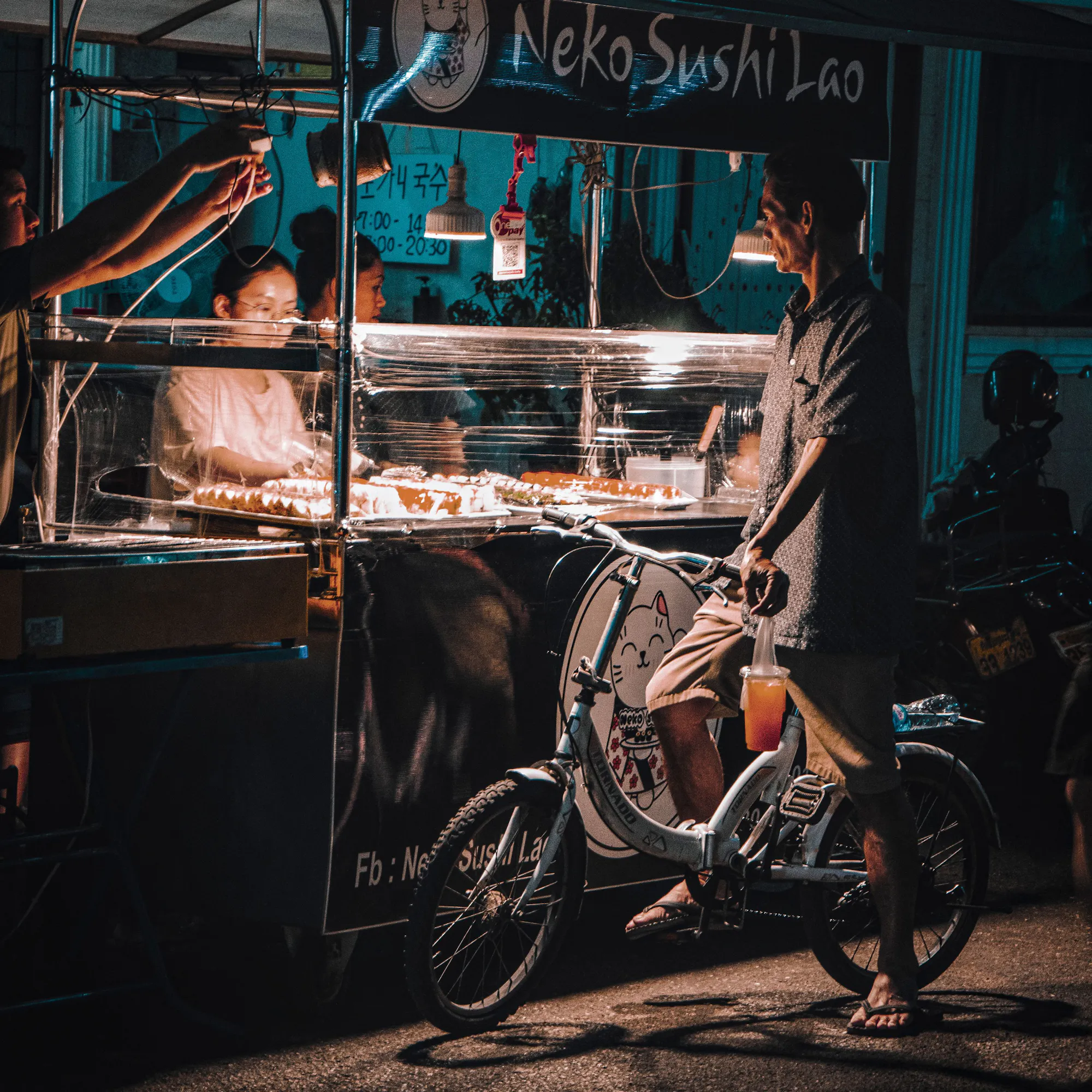 Night street food cart selling sushi in Vientiane, Laos