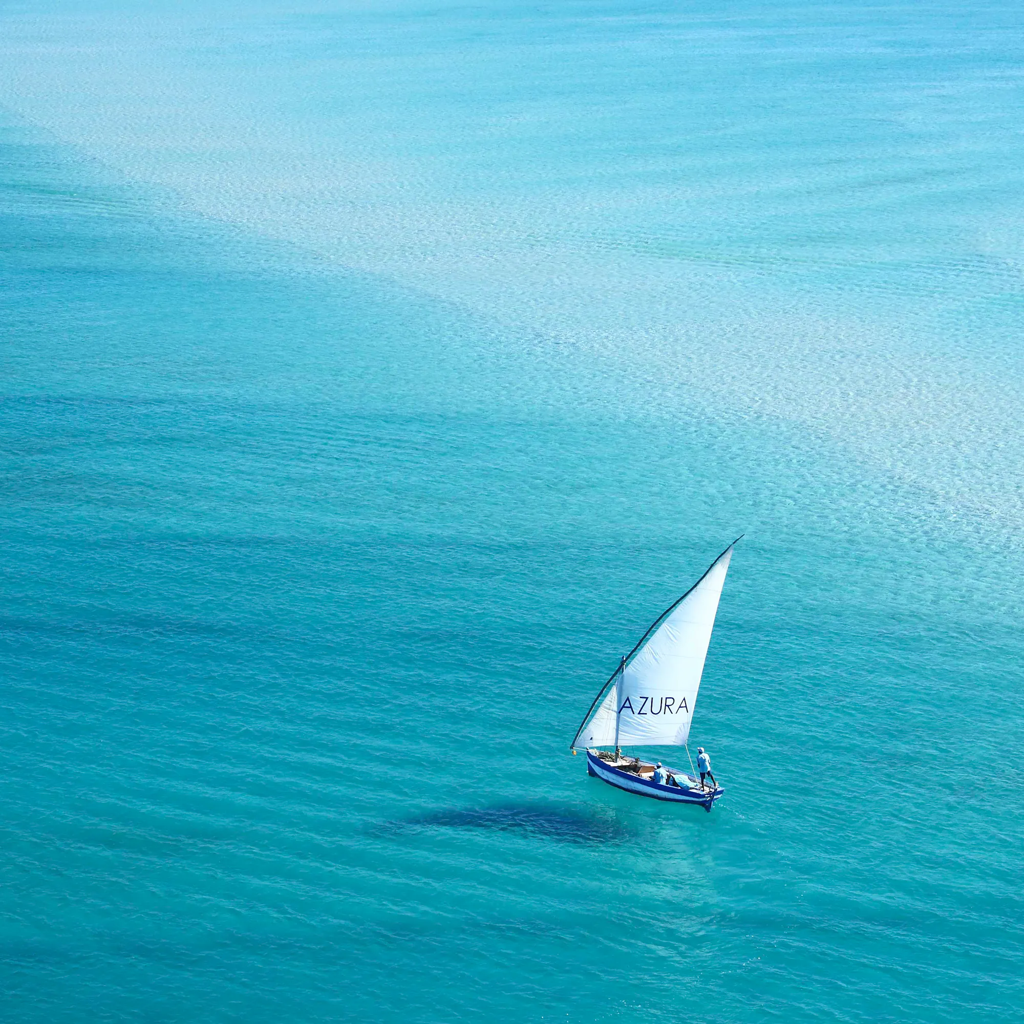Traditional dhow sailboat on turquoise waters off Bazaruto Archipelago, Mozambique