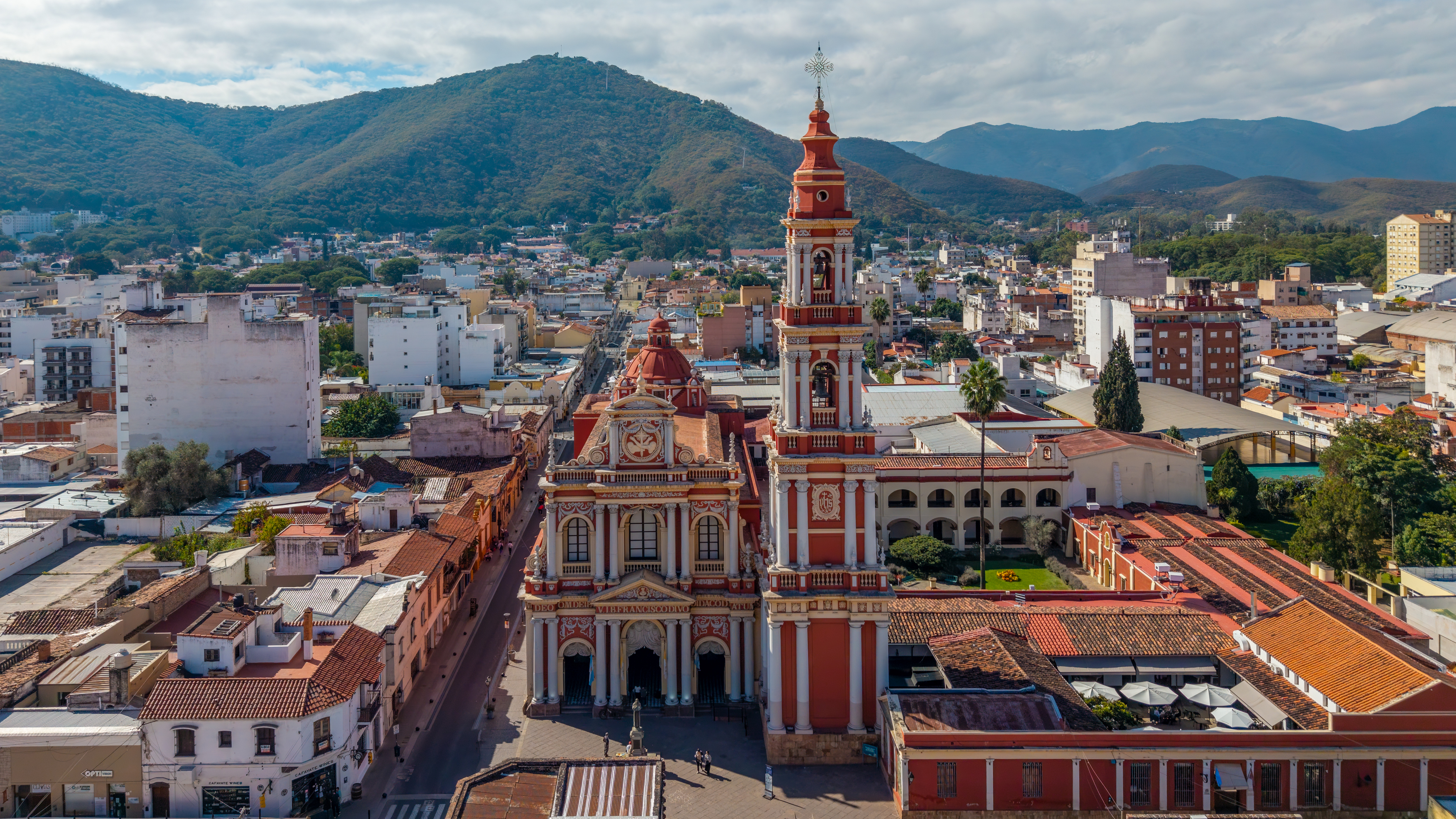 Aerial view of San Francisco Church and downtown Salta, Argentina with mountains behind
