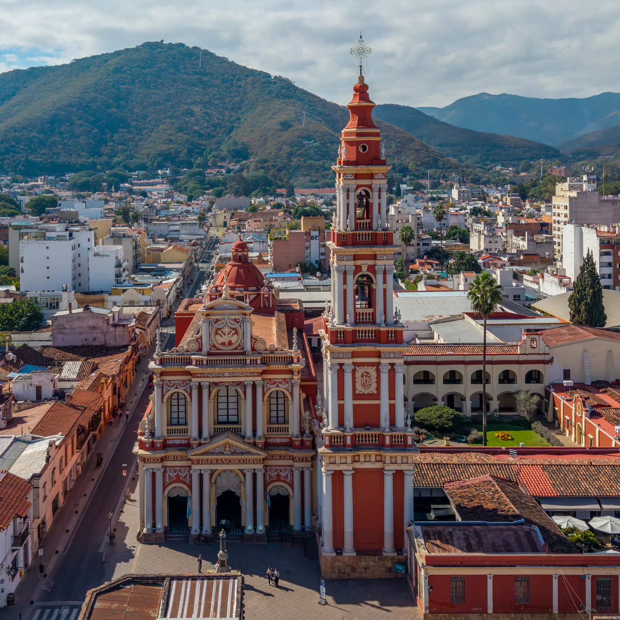 Aerial view of San Francisco Church and downtown Salta, Argentina with mountains behind