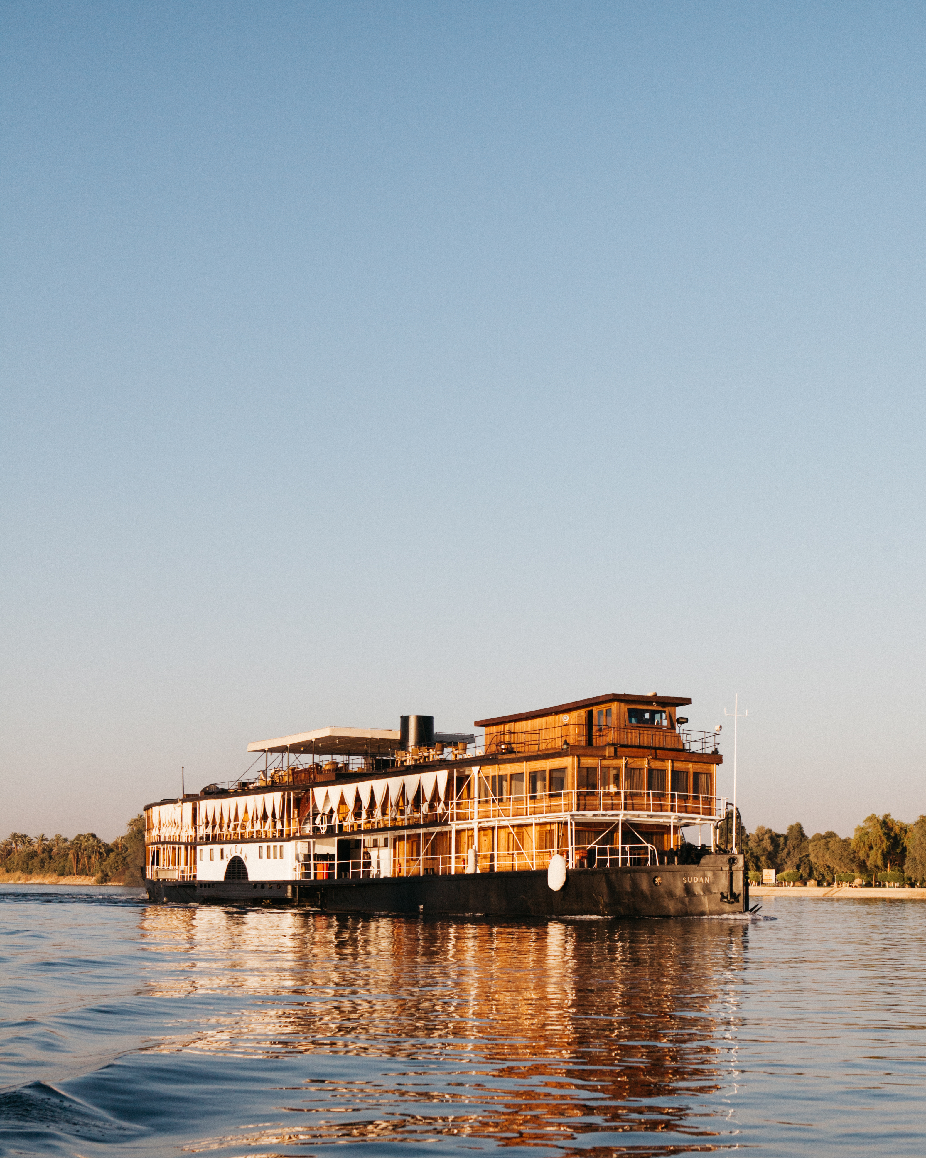Historic SS Sudan steamboat cruising golden Nile River, Egypt