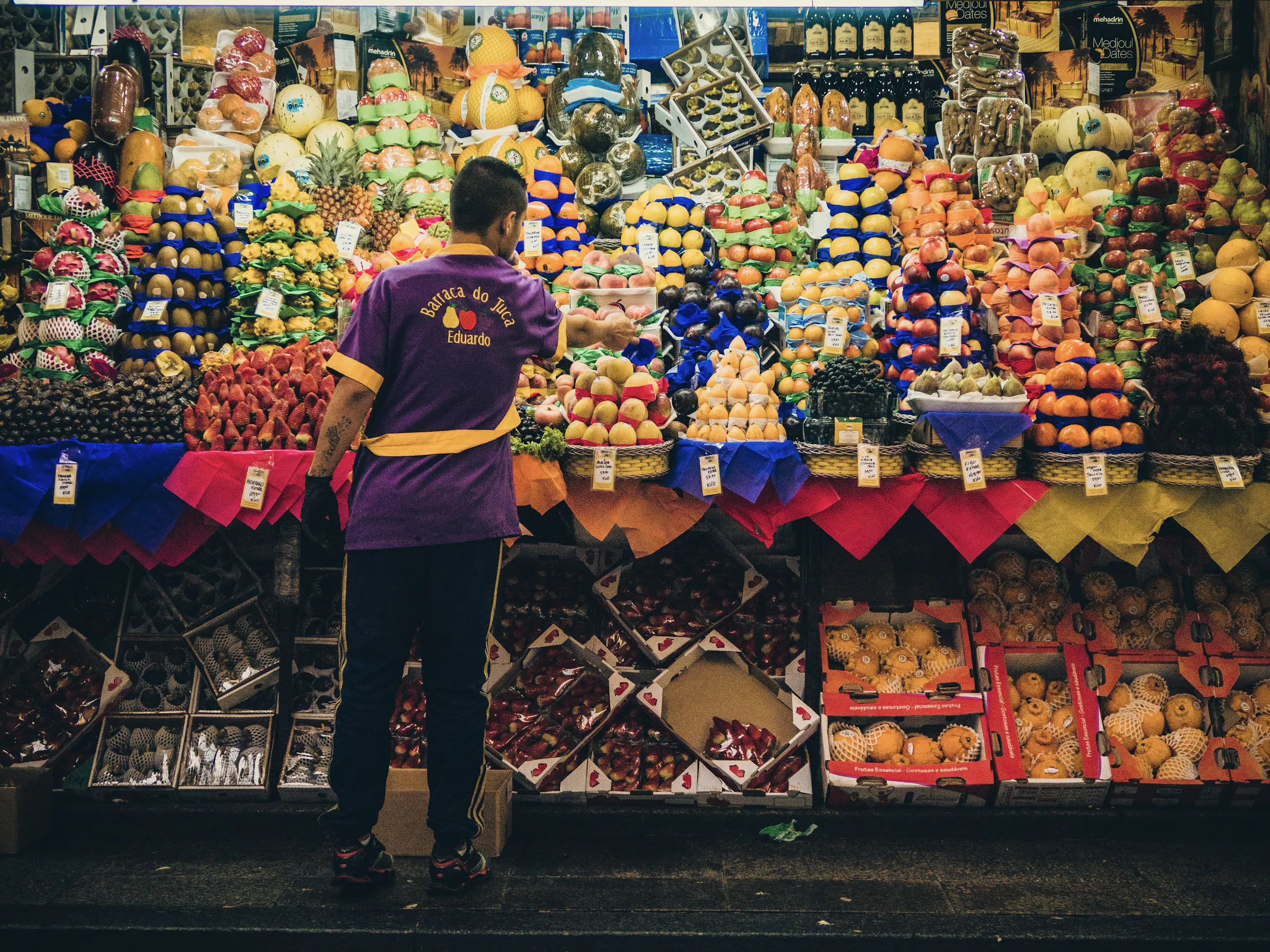Colorful fruit vendor stall at Mercado Municipal, São Paulo Brazil