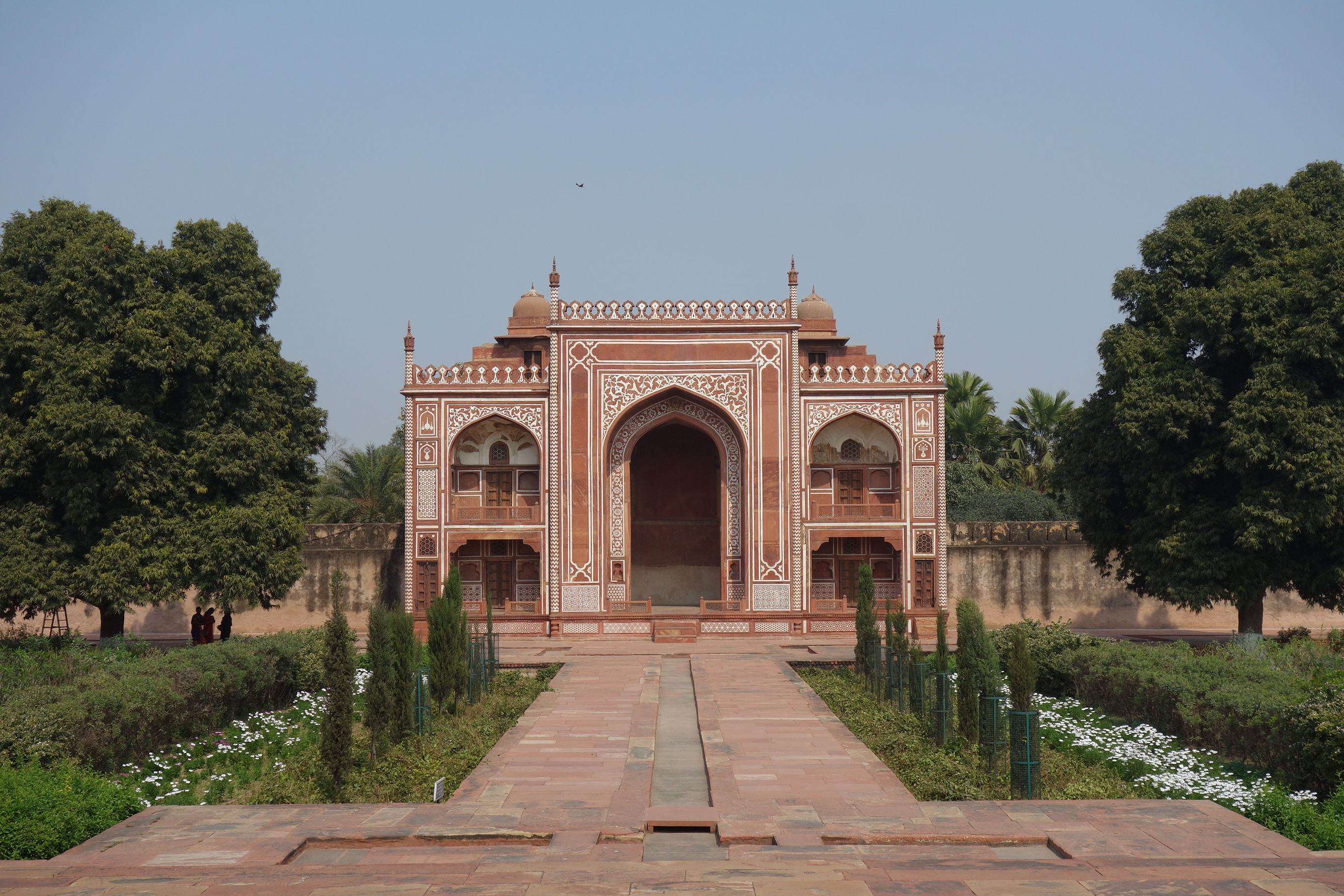 Itmad-ud-Daulah tomb entrance in Agra, India featuring red sandstone and white marble inlay architecture