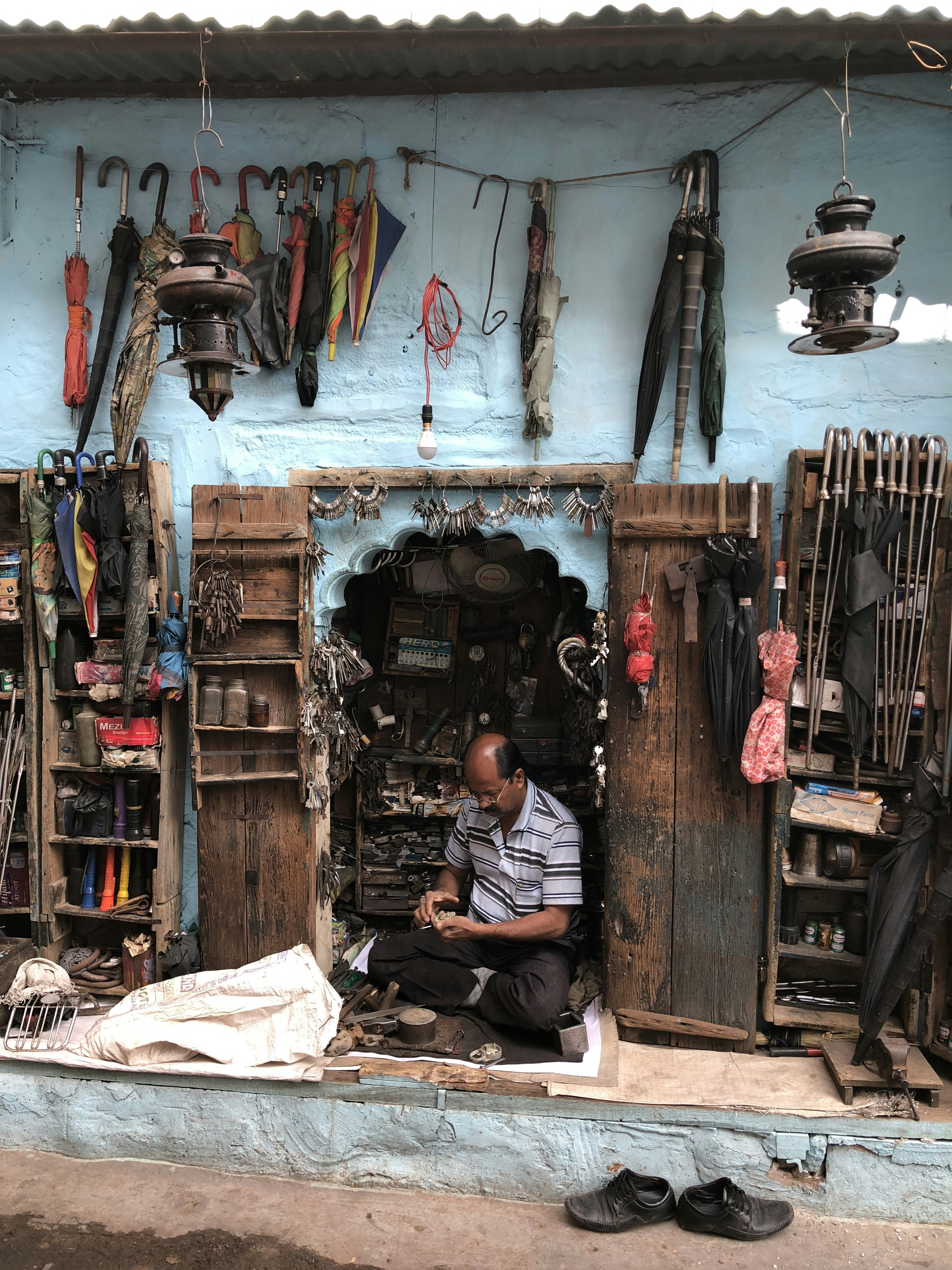 Locksmith and umbrella repair shop in Jodhpur's old city, India
