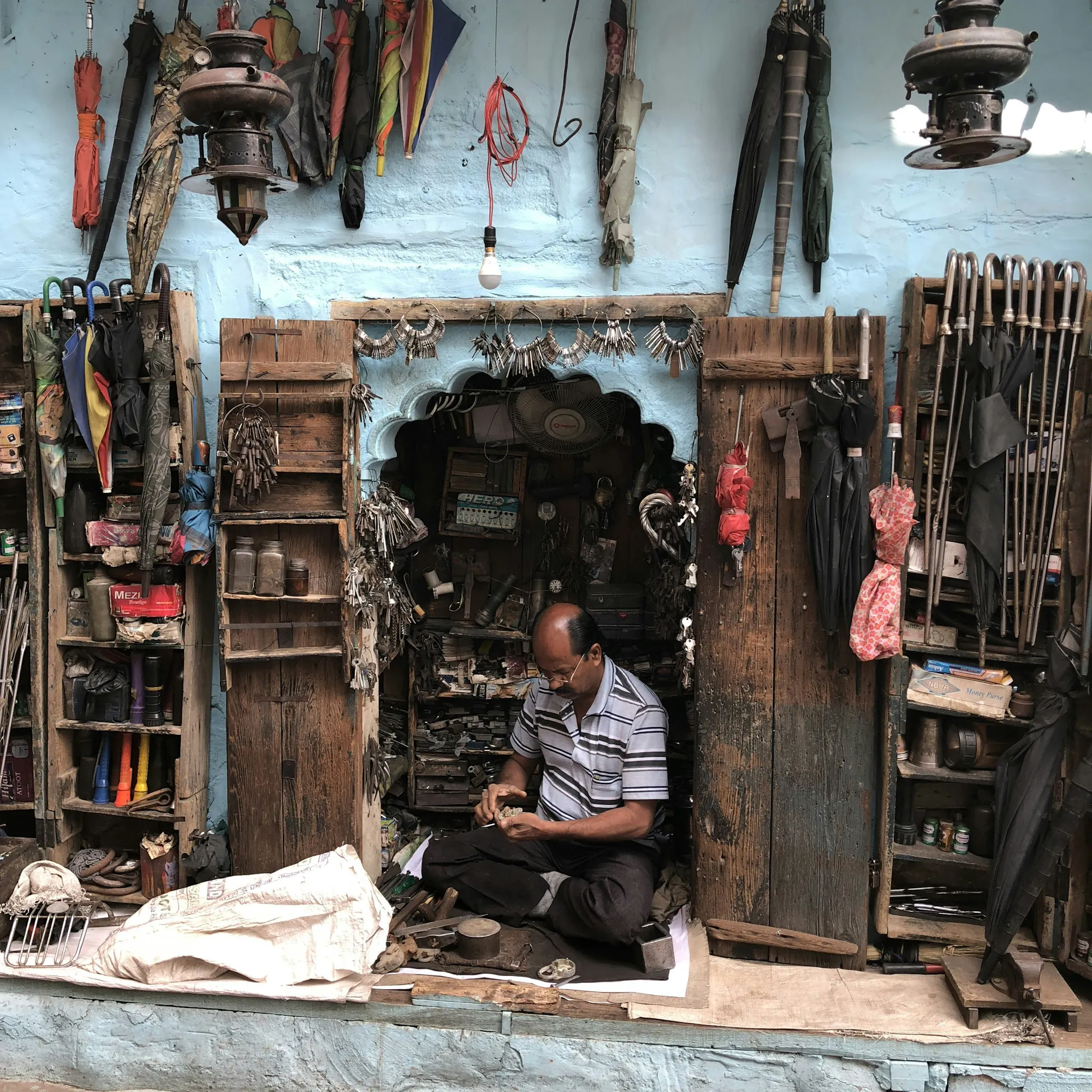 Locksmith and umbrella repair shop in Jodhpur's old city, India