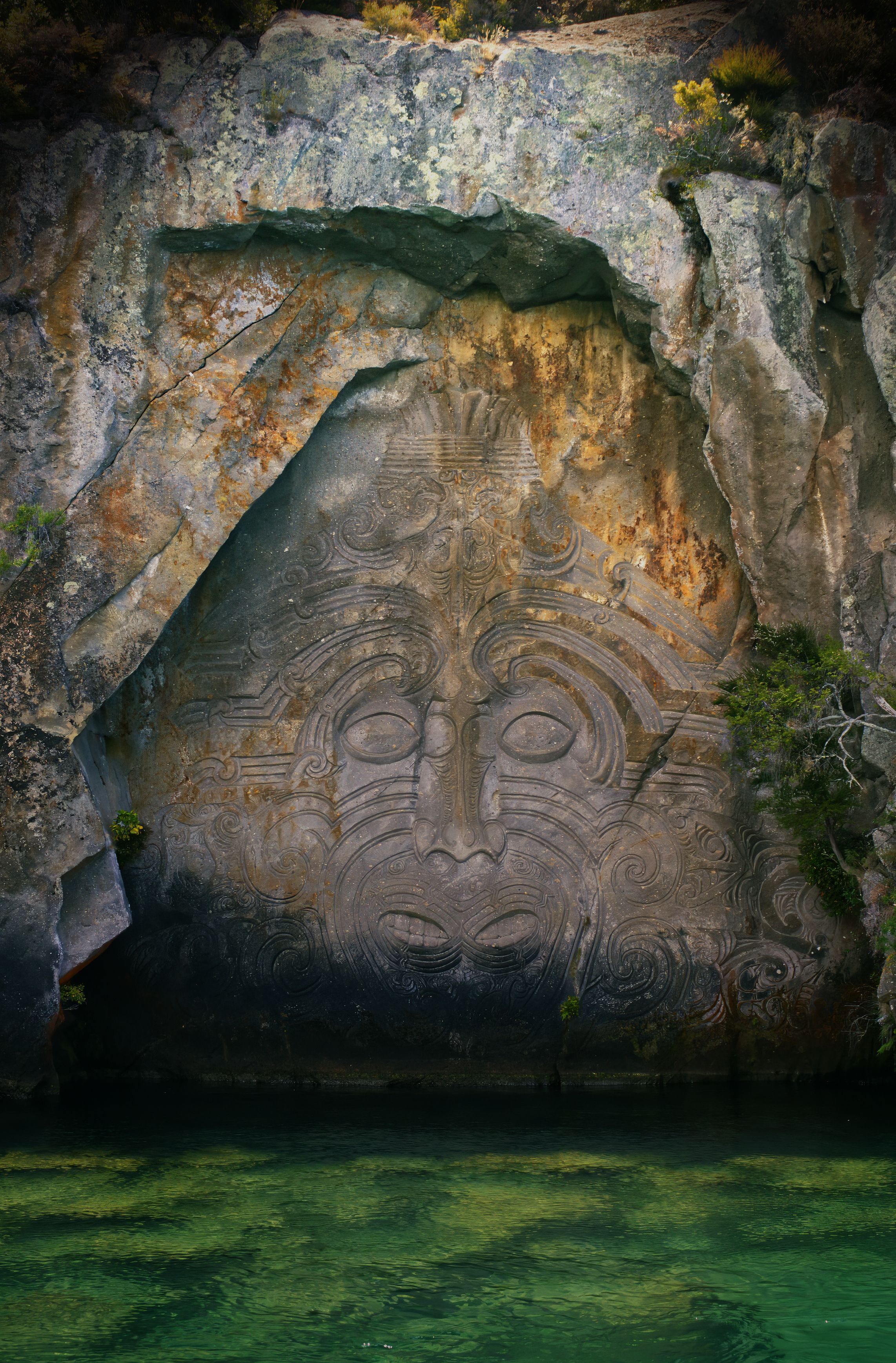 Maori rock carving Mine Bay cliffs above Lake Taupo, New Zealand