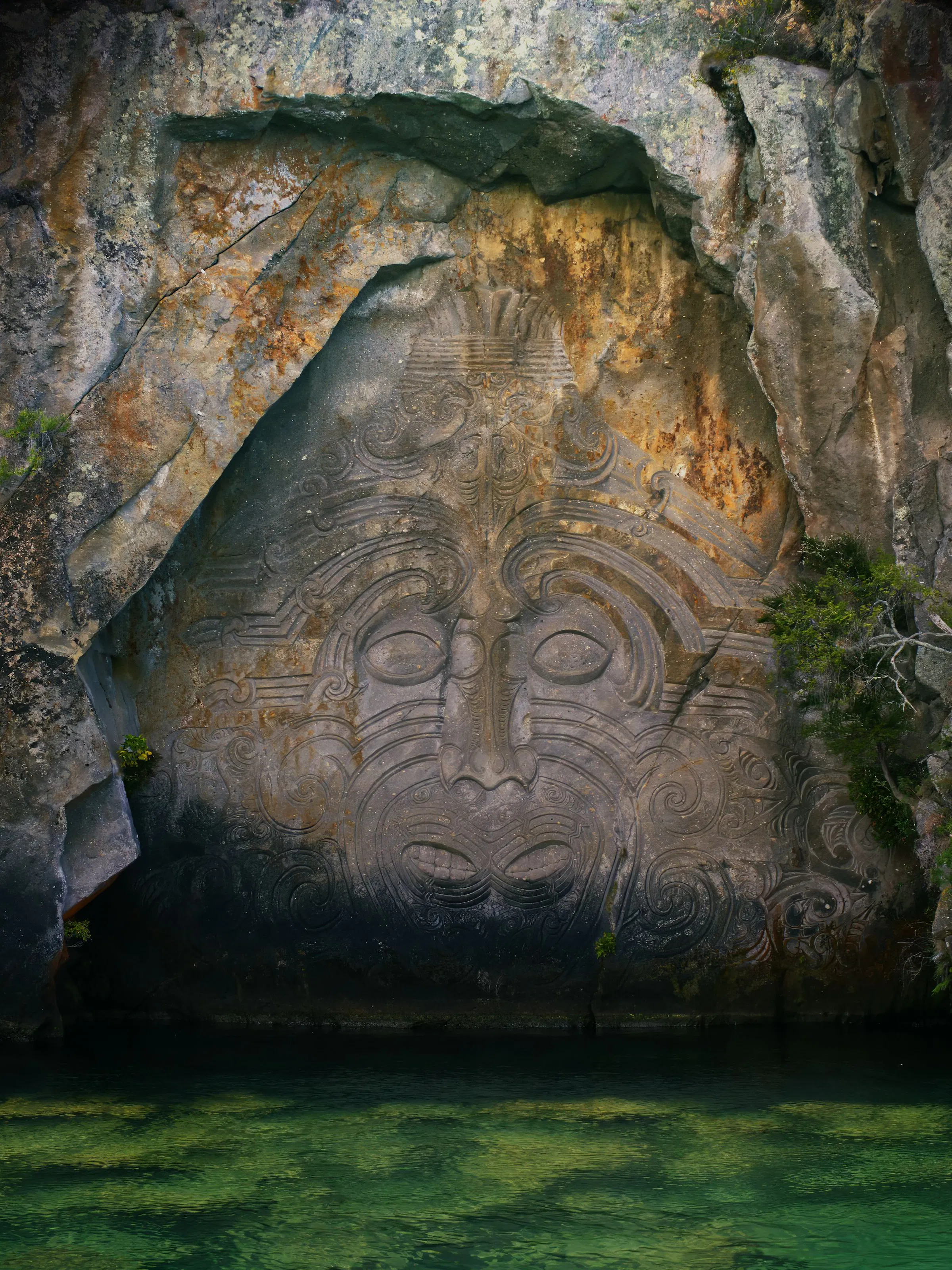 Maori rock carving Mine Bay cliffs above Lake Taupo, New Zealand