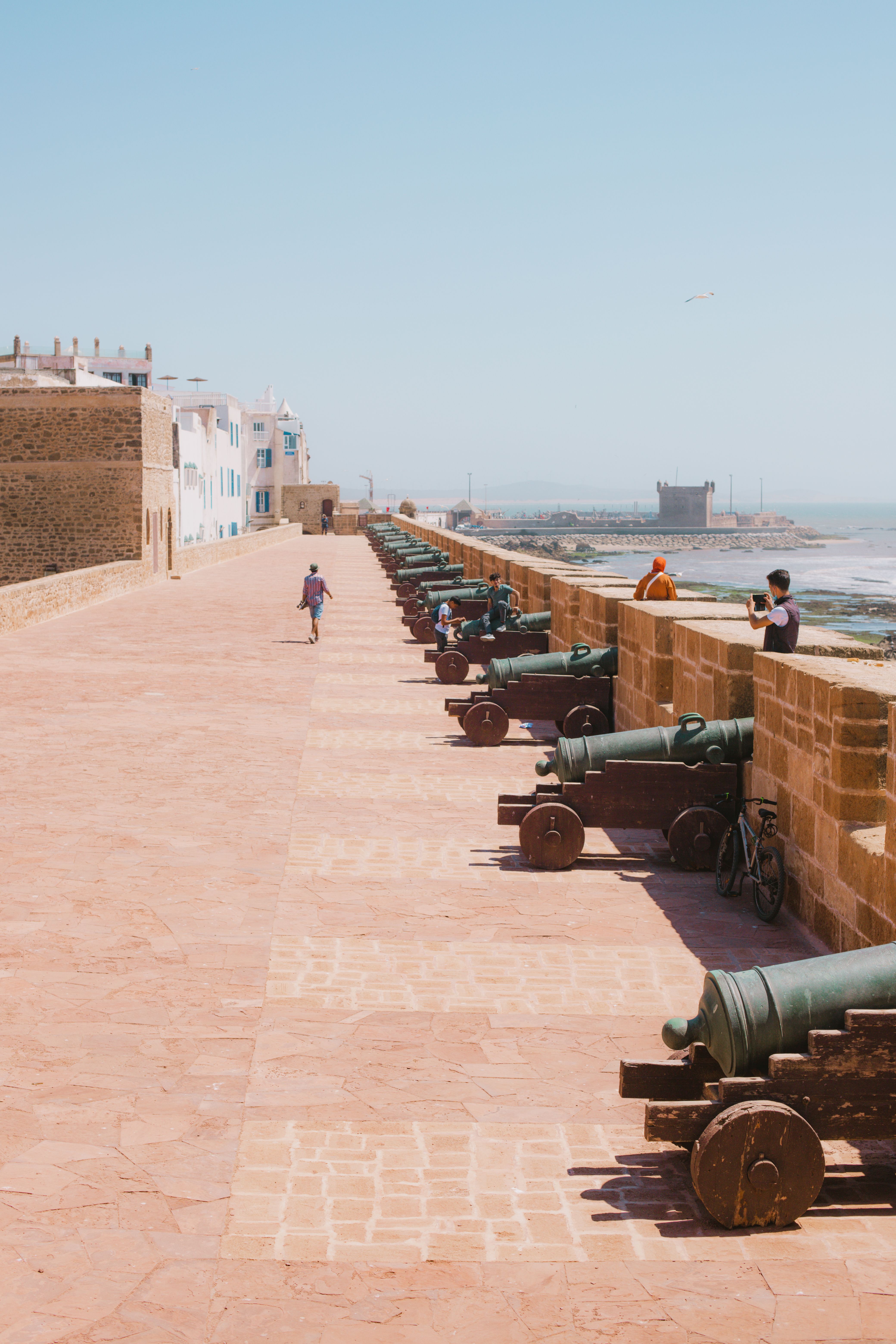 Historic cannons lining the Skala de la Ville ramparts overlooking the sea in Essaouira, Morocco