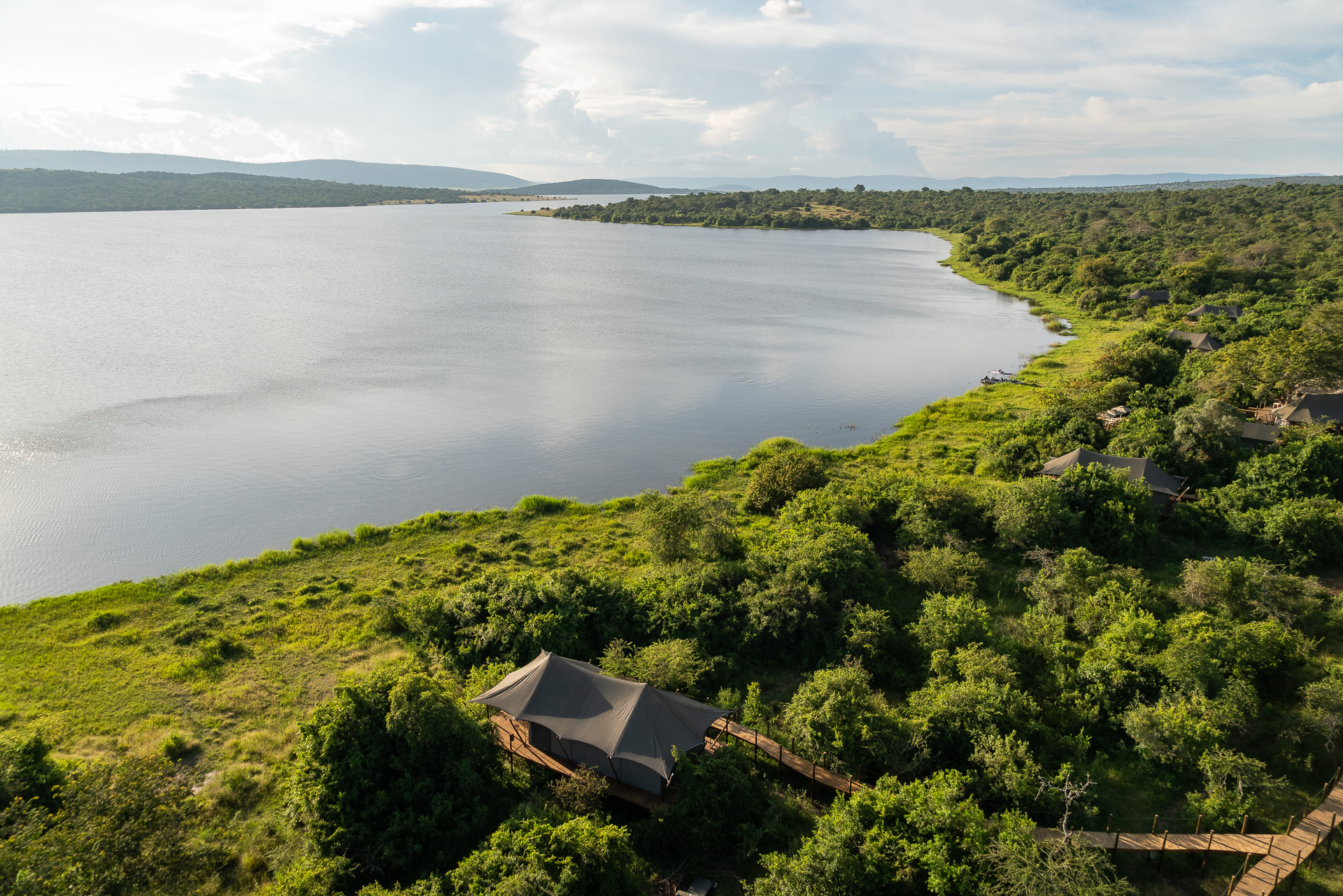 Aerial view of Magashi Camp tents along the lakeshore in Akagera National Park, Rwanda