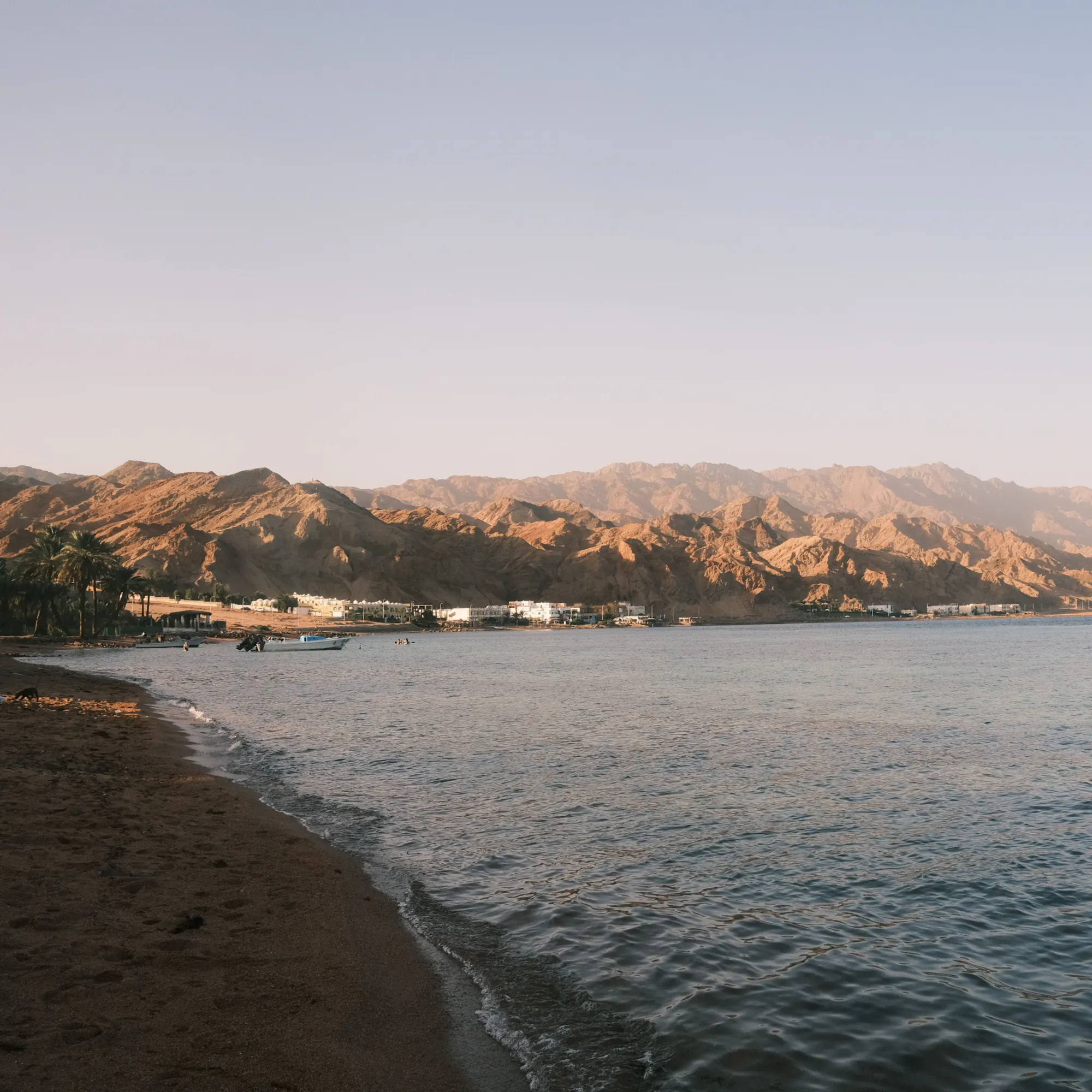 Beach and mountains along a coastal bay in Jordan