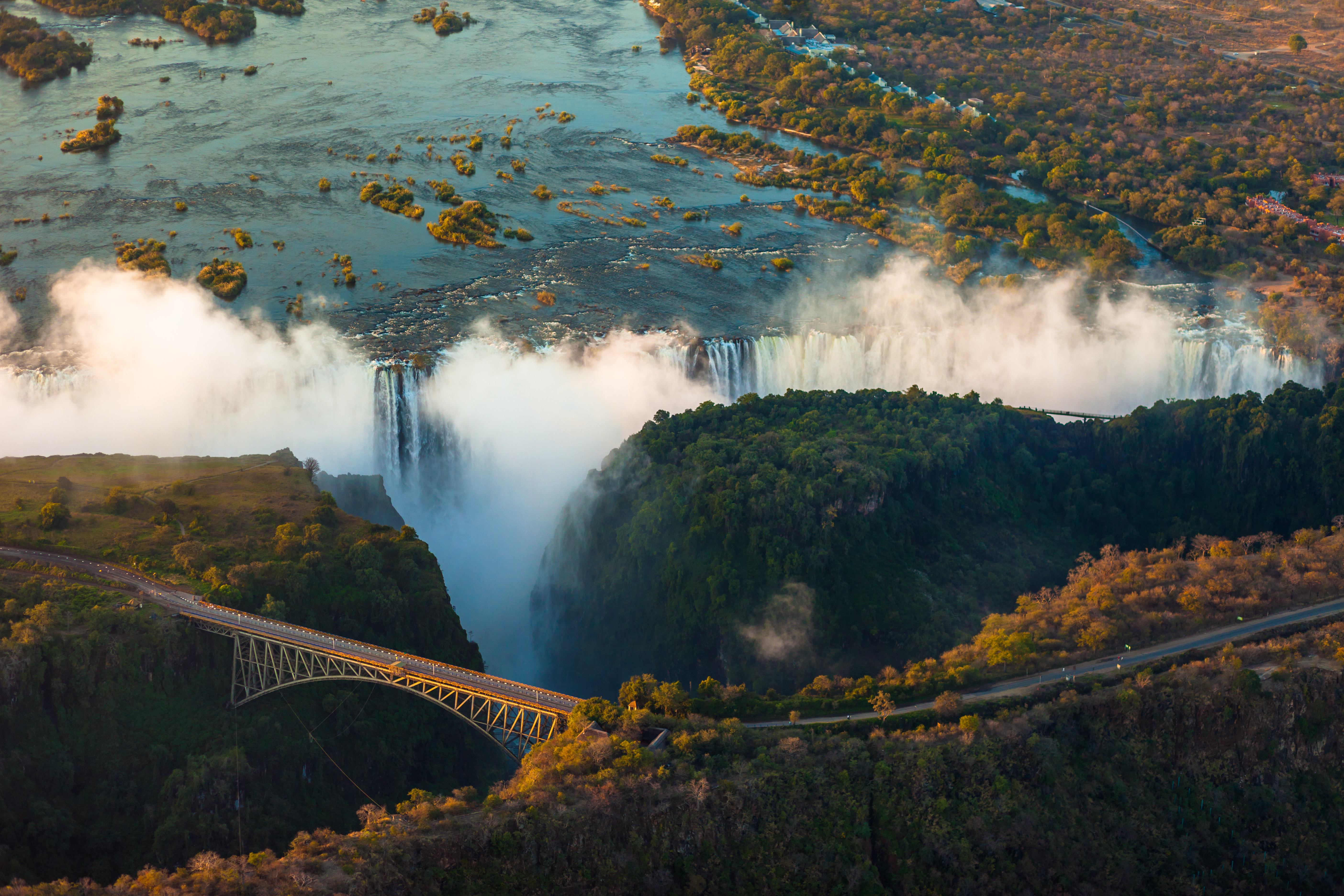 Aerial view Victoria Falls and historic bridge, Zimbabwe Zambia border