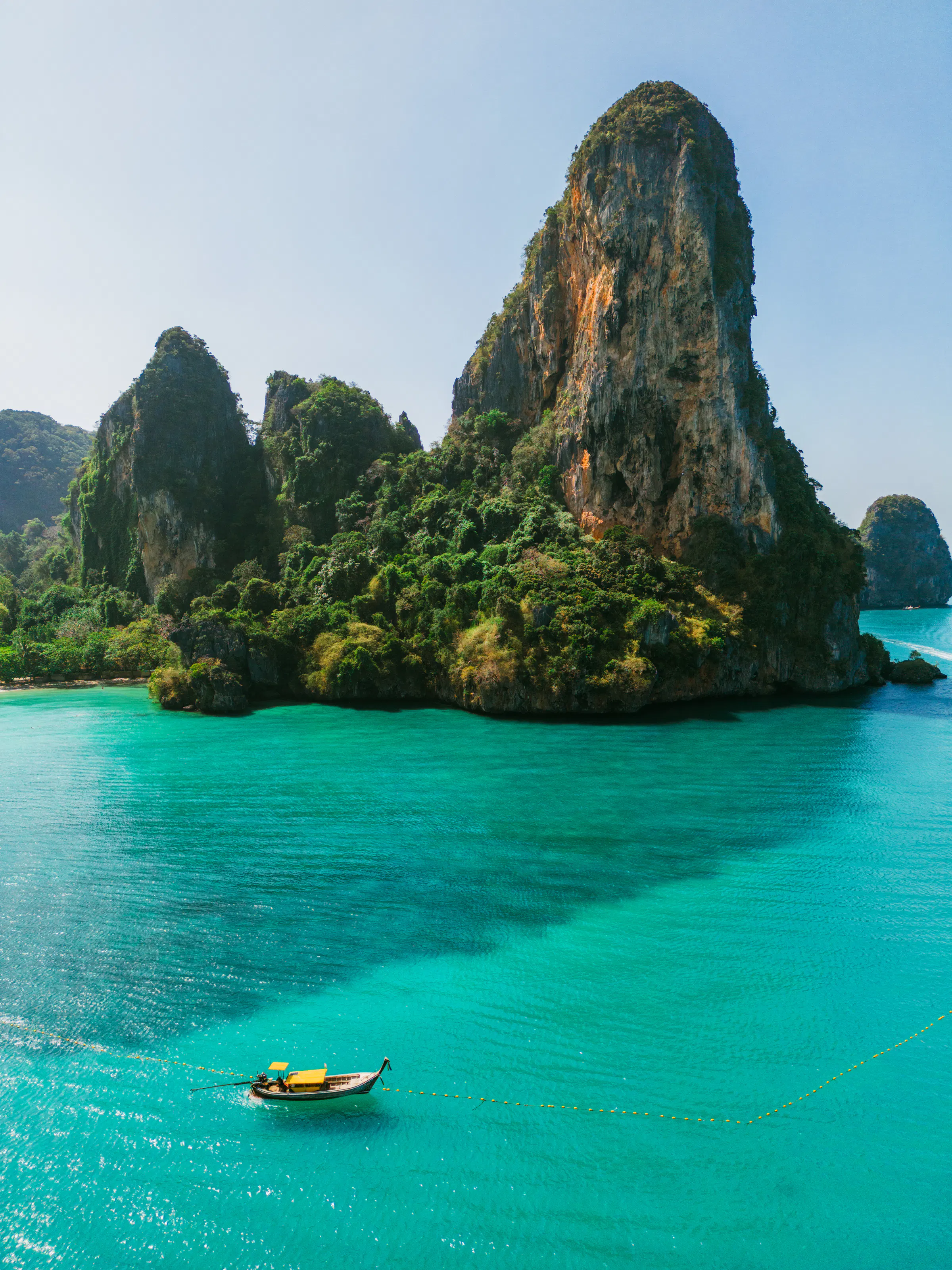 Longtail boat on turquoise sea, Railay Beach Krabi Thailand