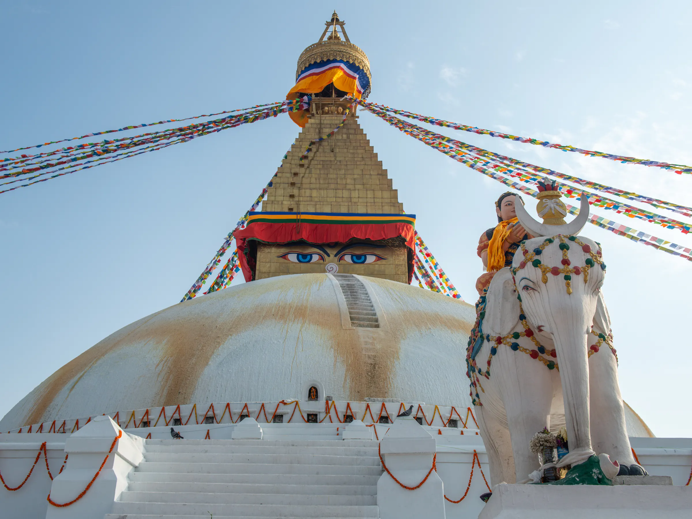 Boudhanath Stupa with Buddha eyes and prayer flags in Kathmandu, Nepal