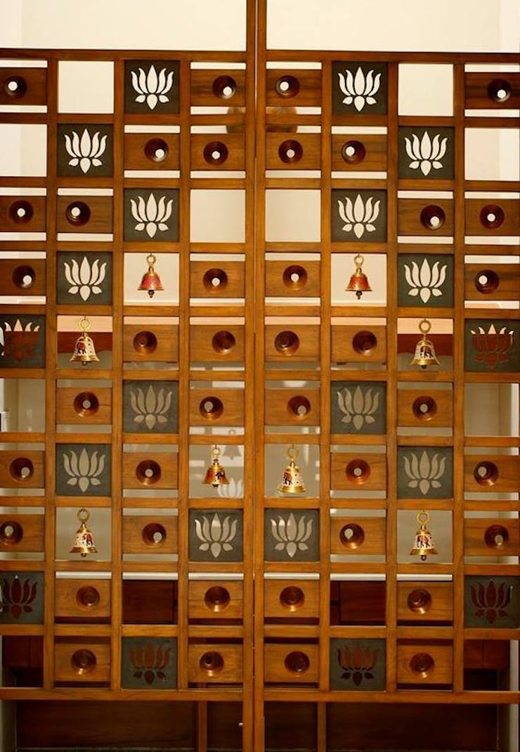 Wooded origami Thakur Ghar door interior design