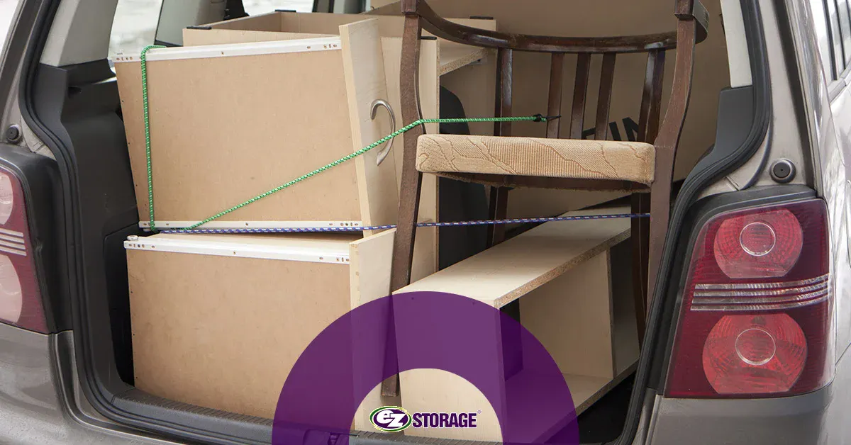 Furniture tied up in a car for moving