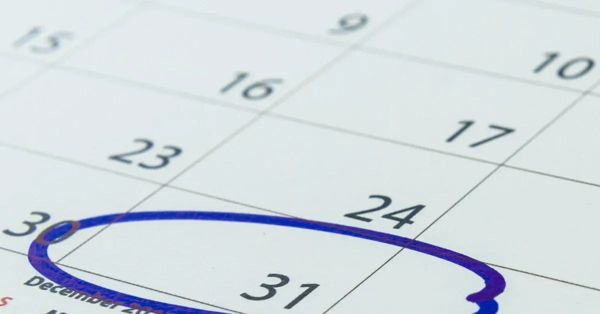 Close up of paper calendar with the 31st circled in blue ink.