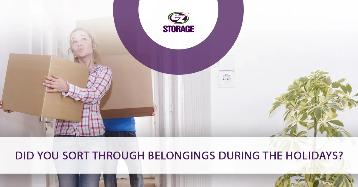 Man and women entering a room with boxes and text "Did you sort through belongings during the holidays?"