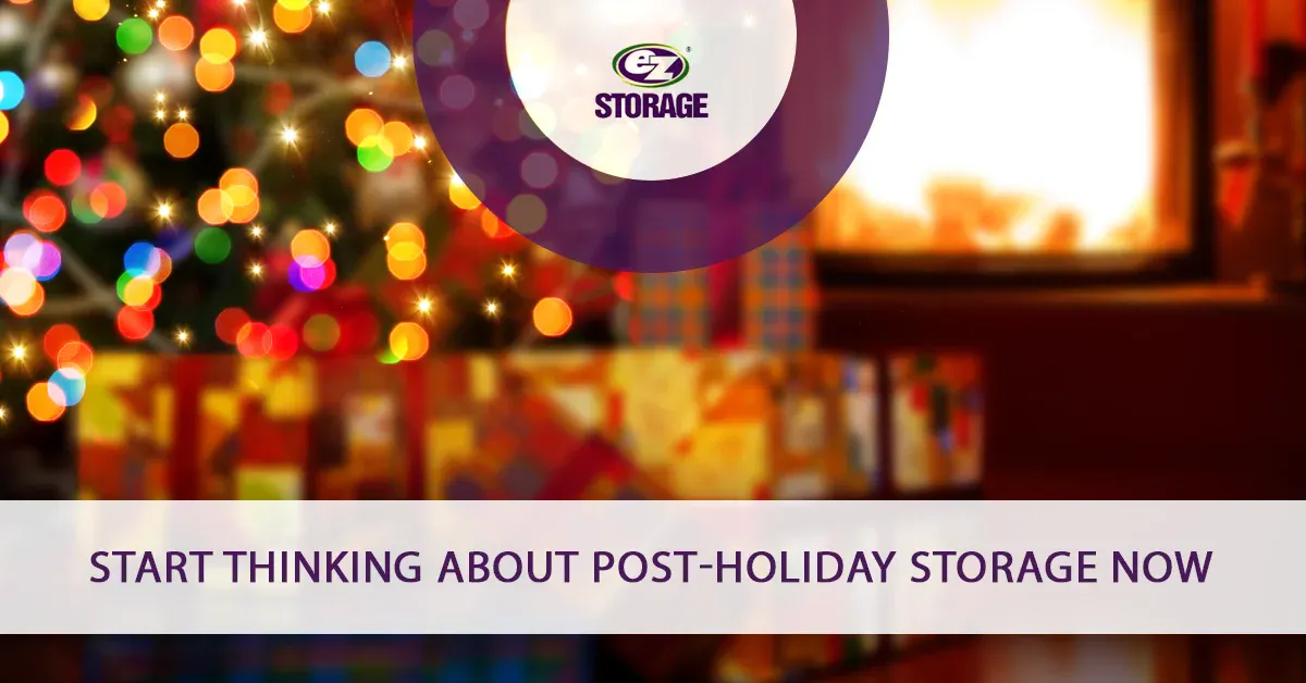 Blurred christmas like backround of christmas tree and gifts with text "Start thinking about post holiday storage now"