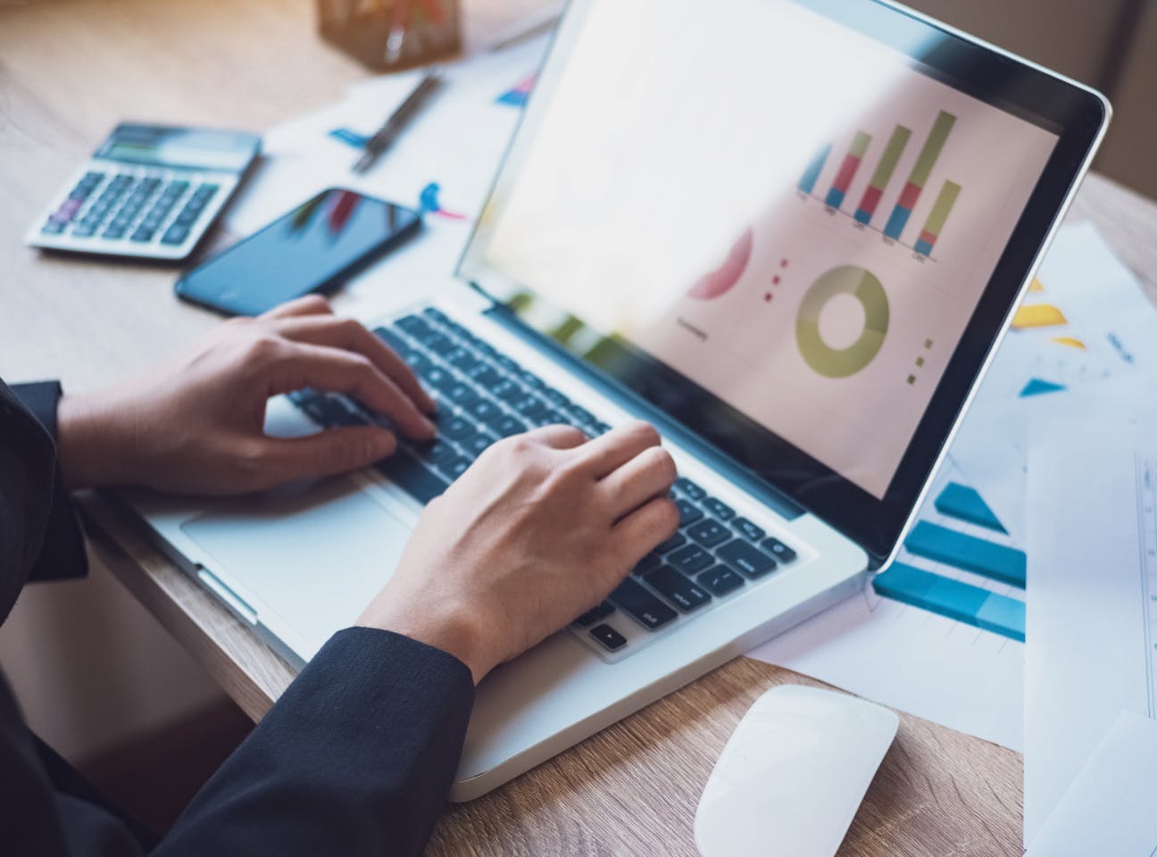 Image of hands typing on laptop