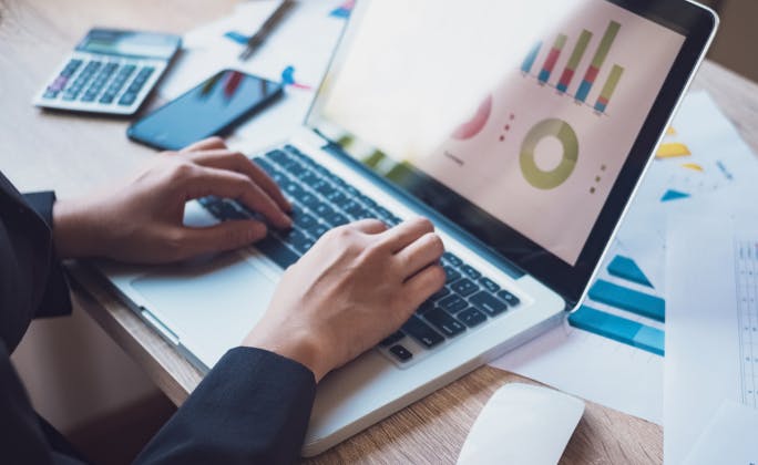 Image of hands typing on laptop
