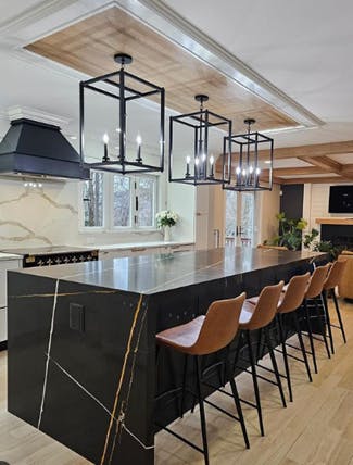 black cabinets and fixtures with dramatic lighting 