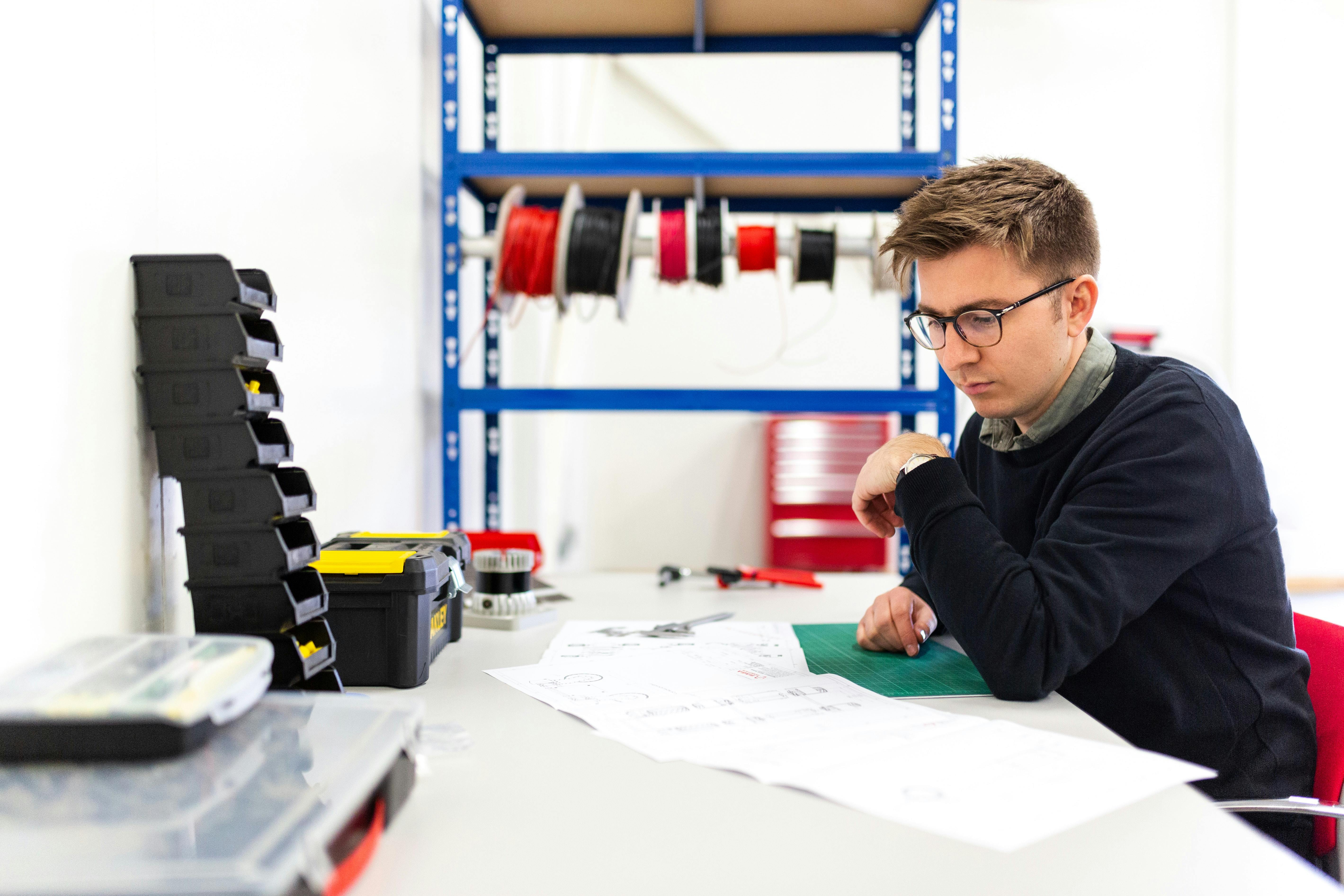 Engineer studying technical documents