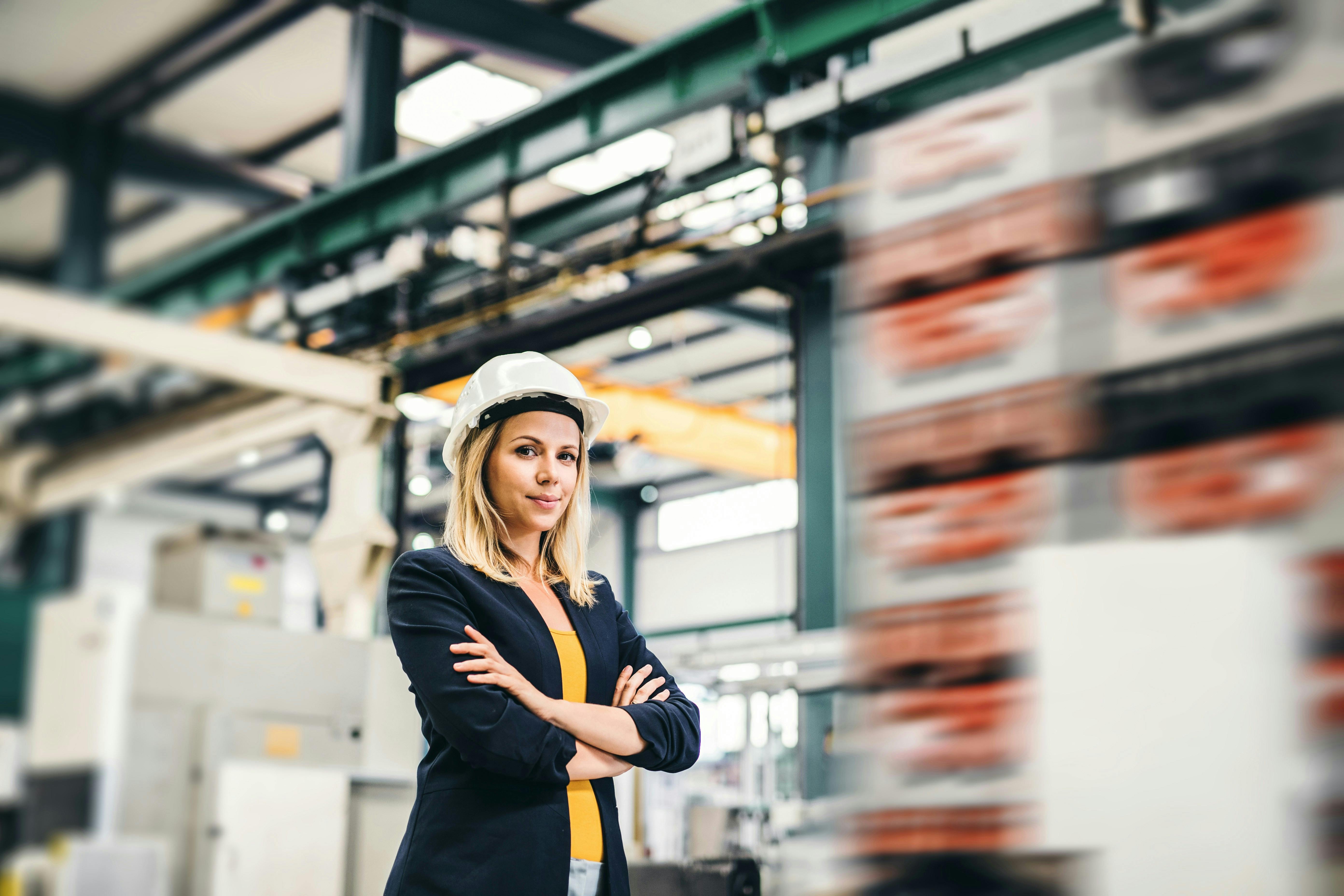A site leader standing next to the warehouse