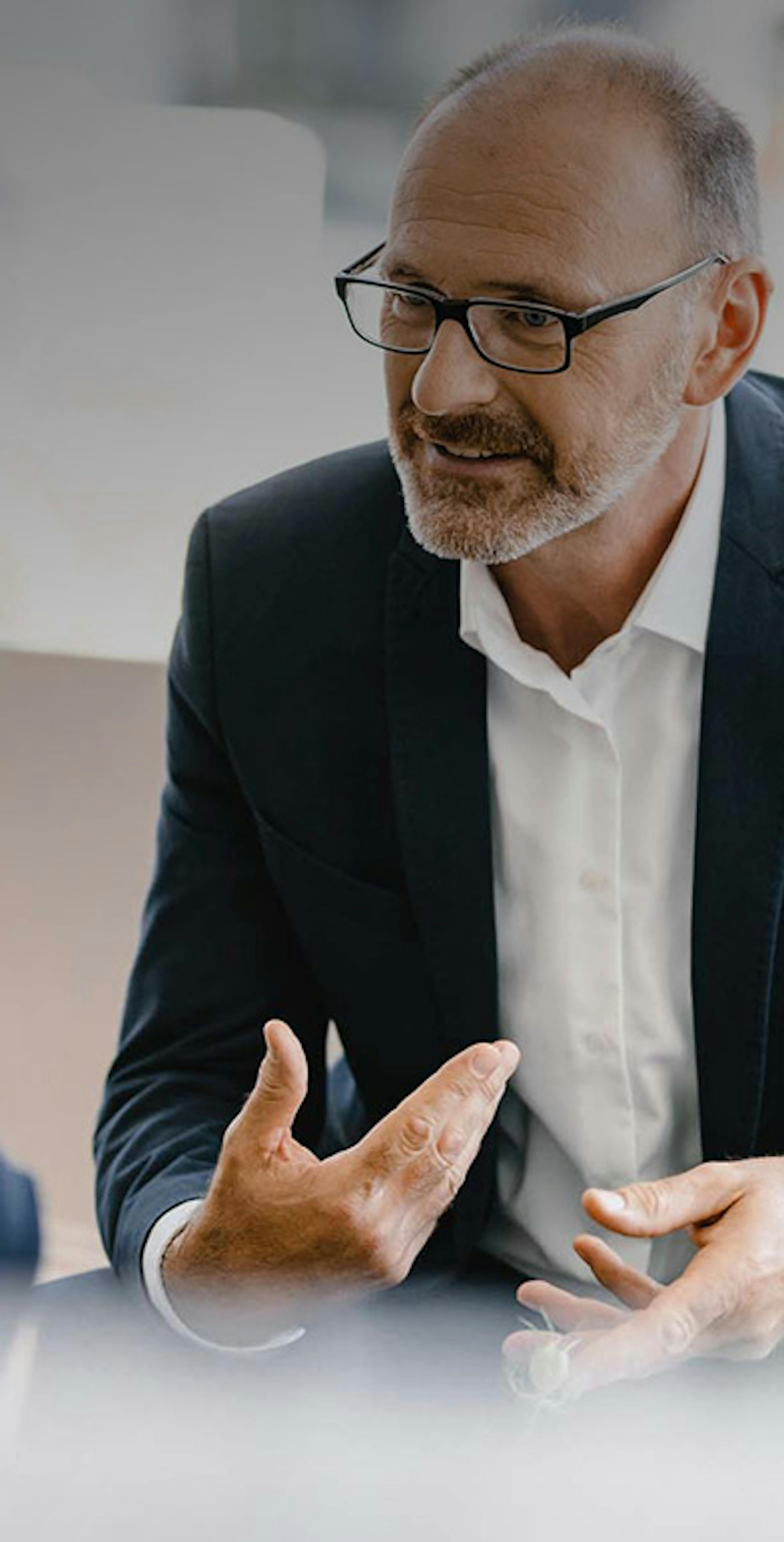 Photograph of an advisor speaking to a client