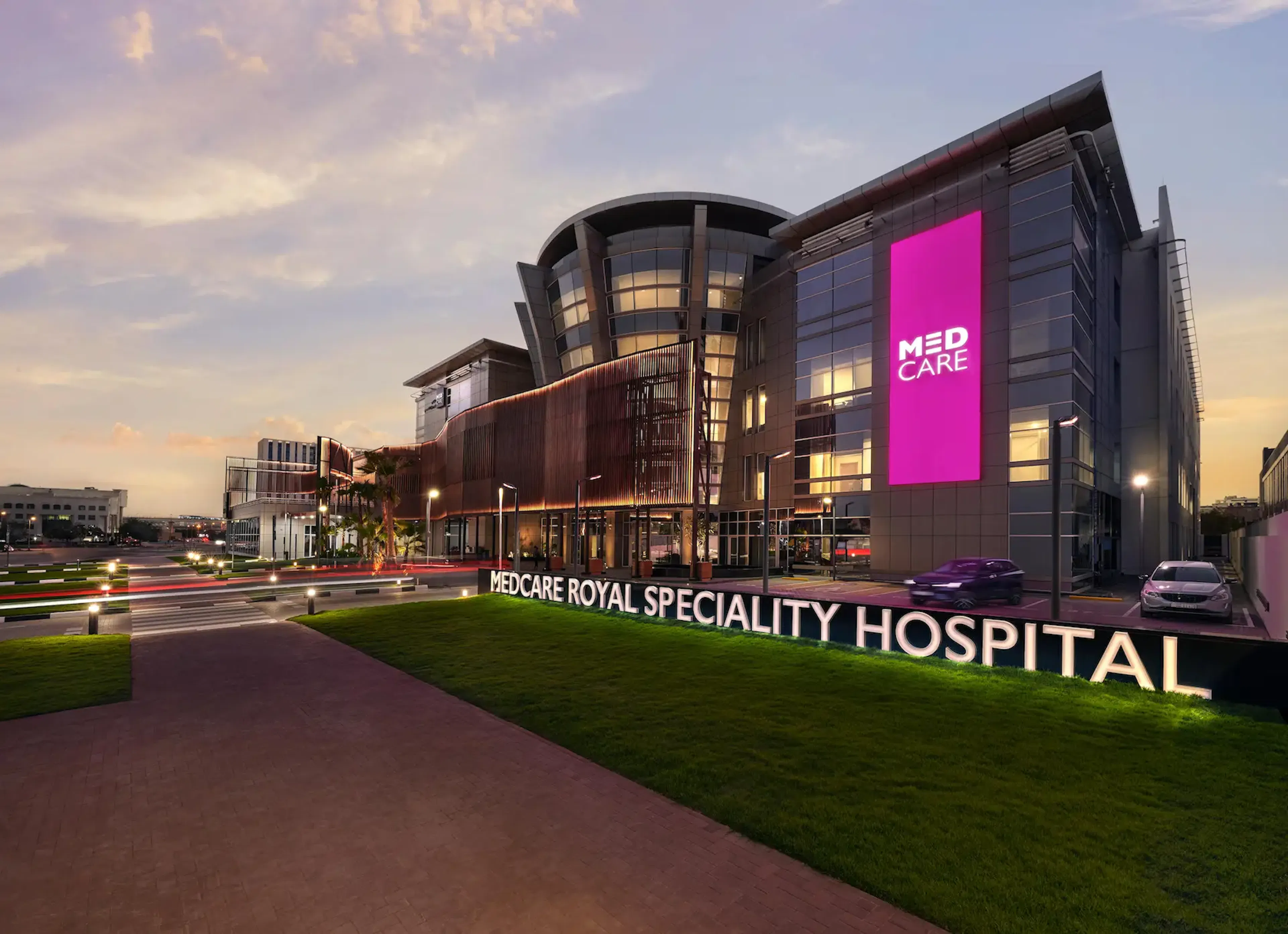 Medcare Royal Speciality Hospital exterior at dusk