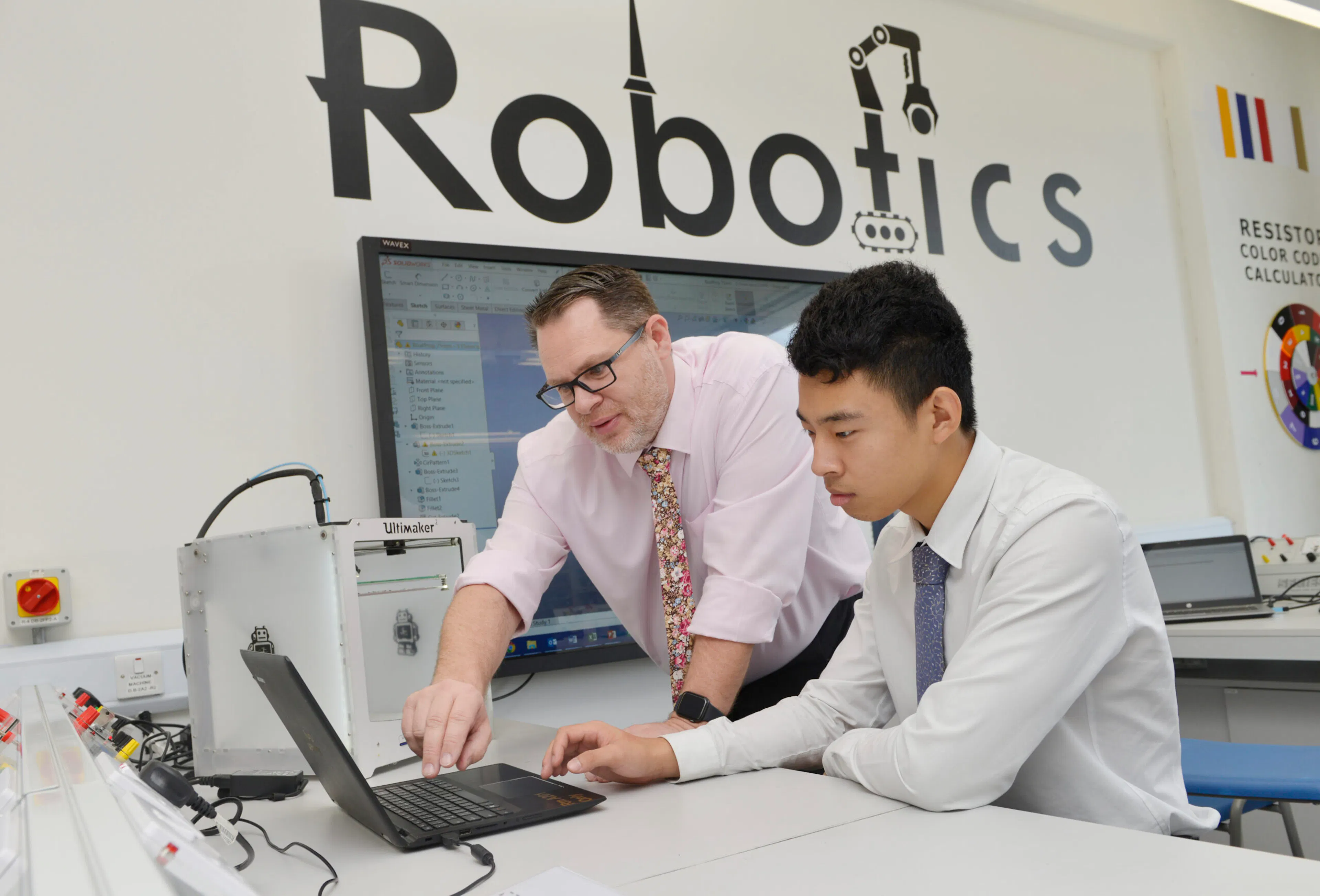 Students working on a robotics and electronics project at a GEMS school