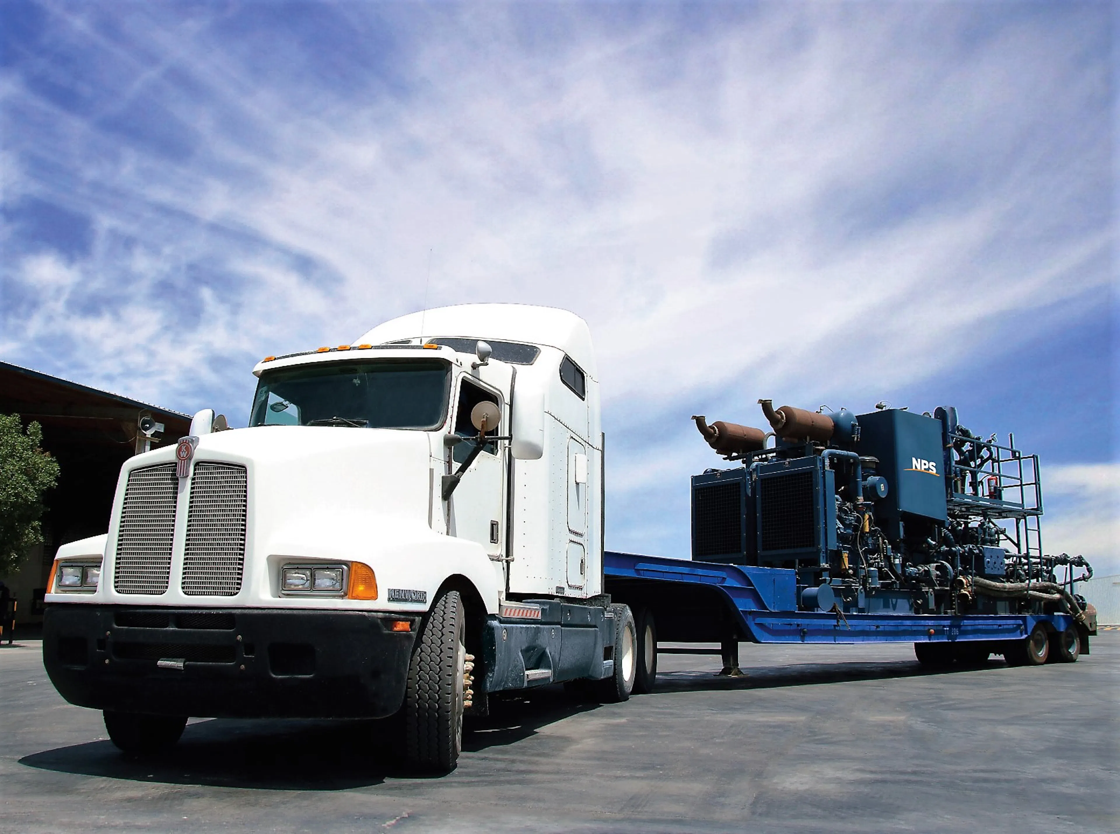 White truck carrying equipment