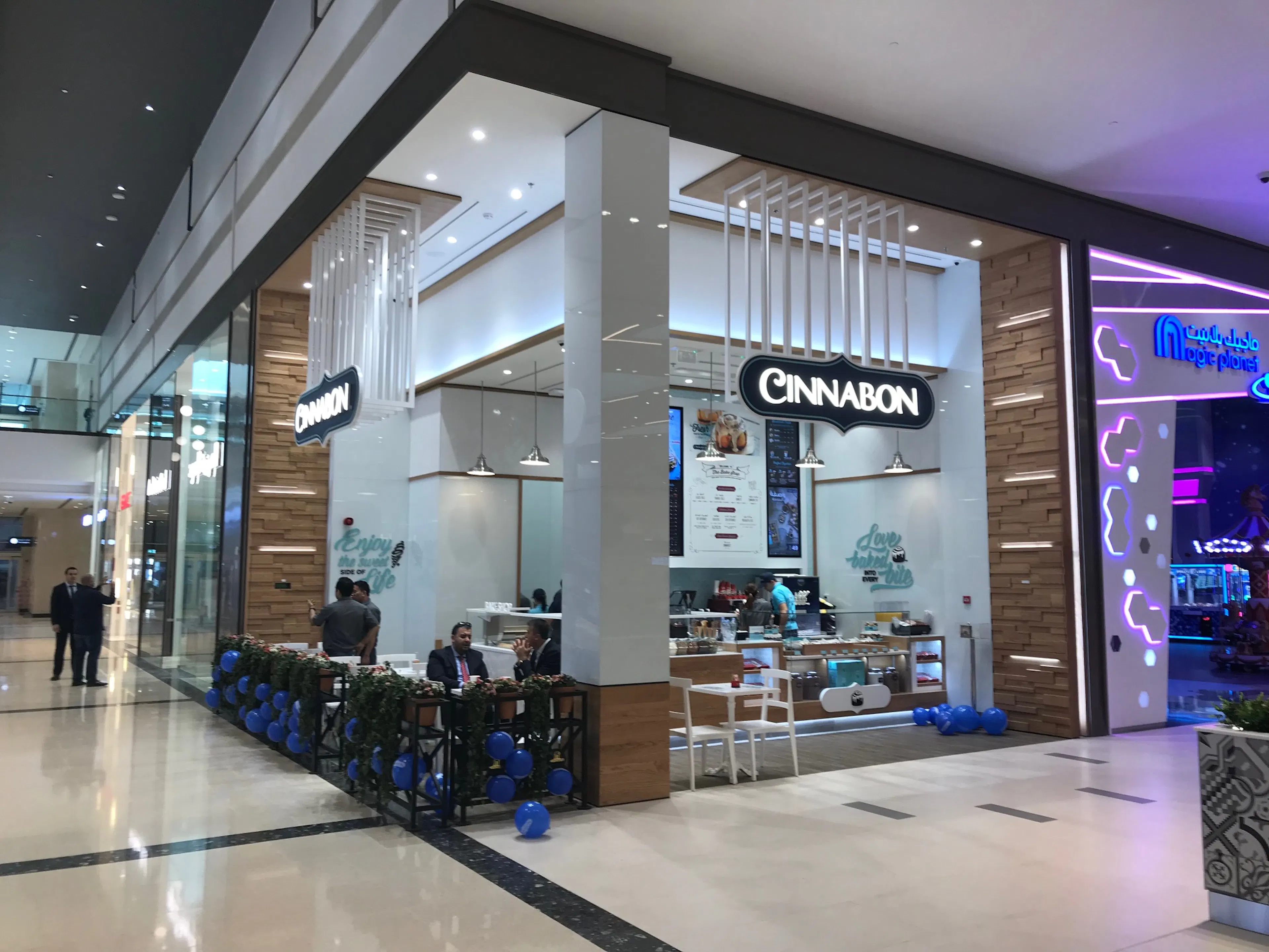 Cinnabon and Seattle's Best Coffee storefronts inside a shopping mall