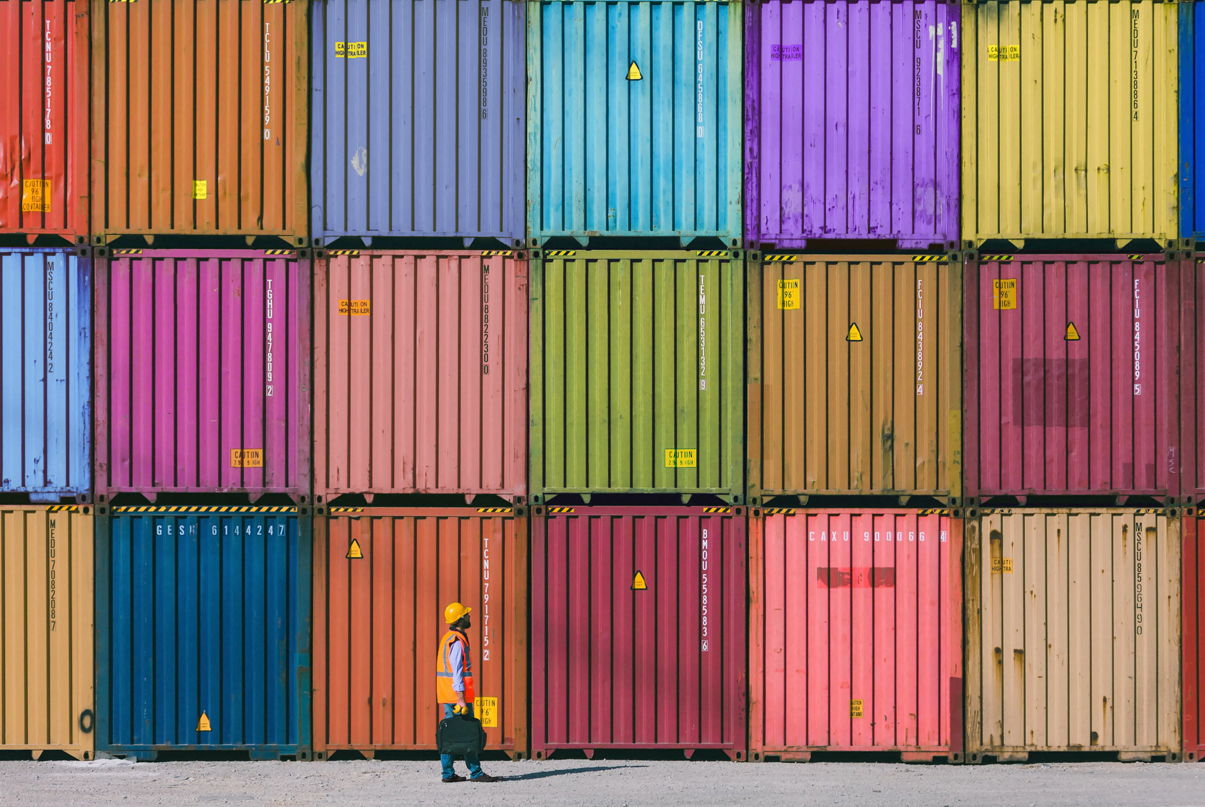 Colourful shipment containers stacked on top of each other