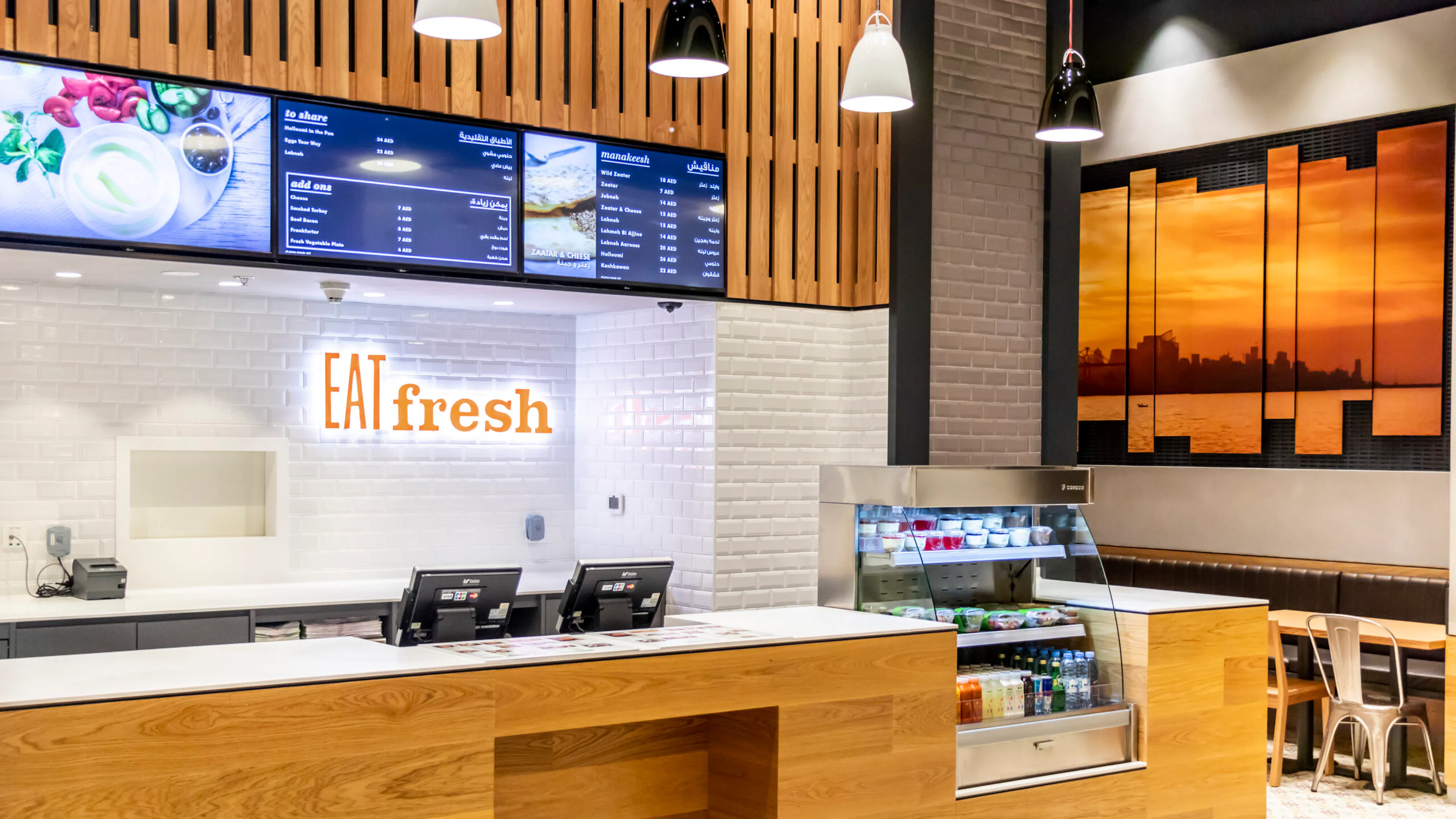 Eat Fresh restaurant interior with digital menu displays