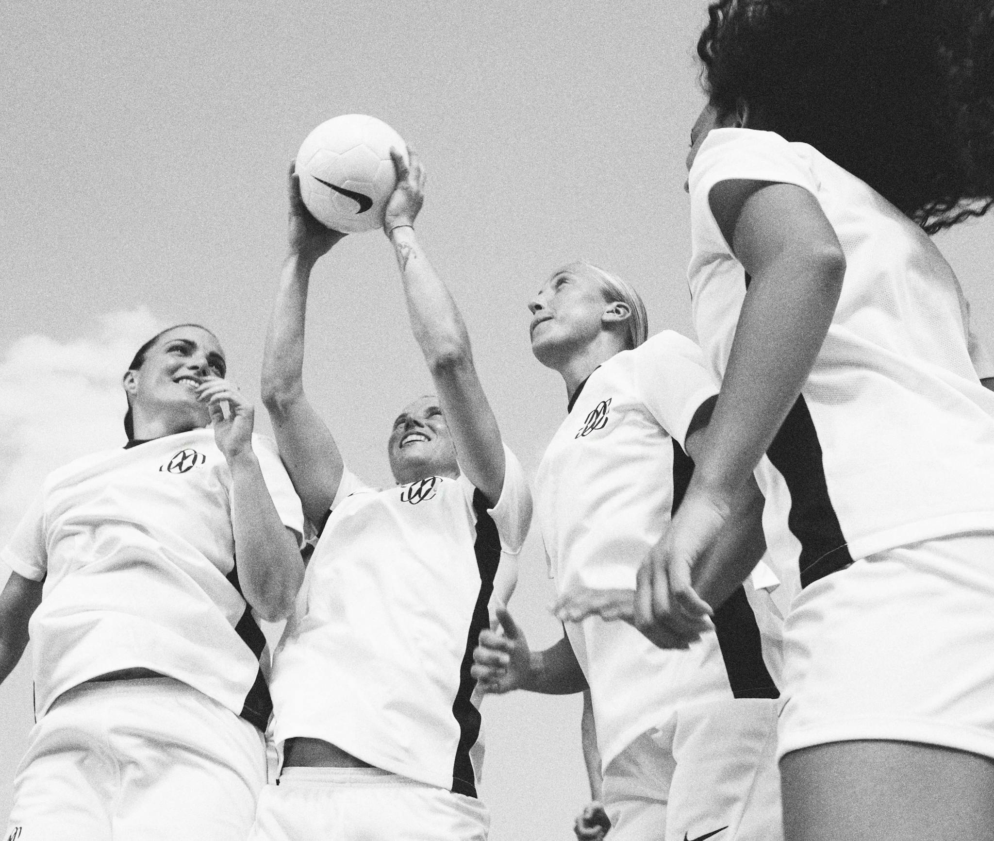 Four Como players in white kits