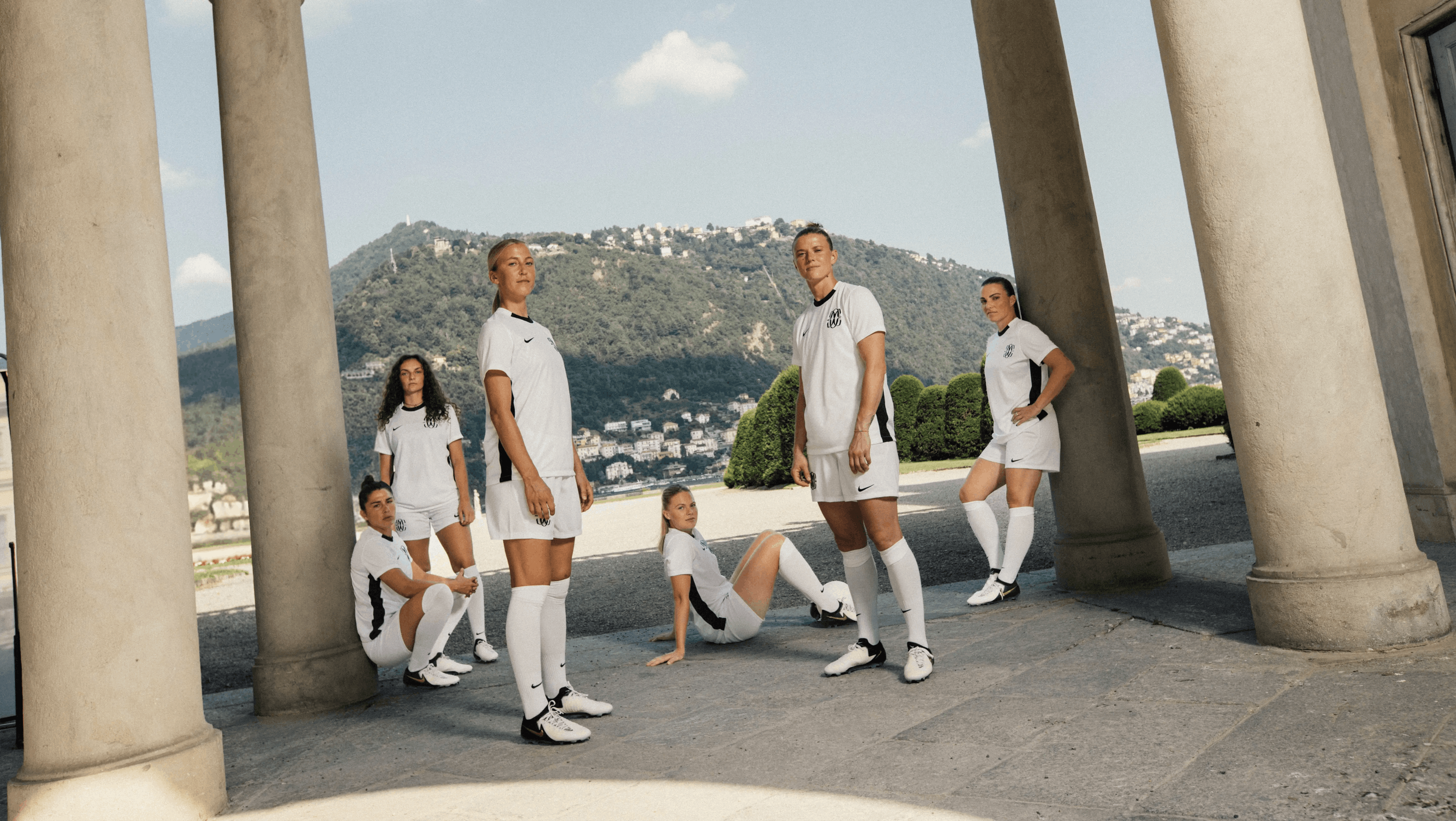 Six Como players in white kits